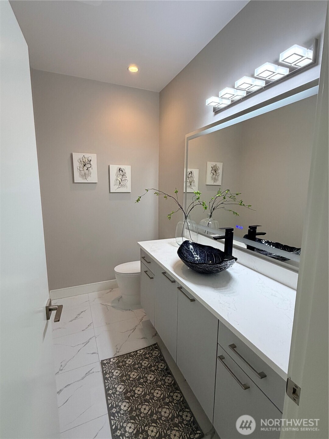 4305 Northeast 26th Court Renton, WA 98059 - Photo 14 of 40 a bathroom with a sink toilet and a mirror