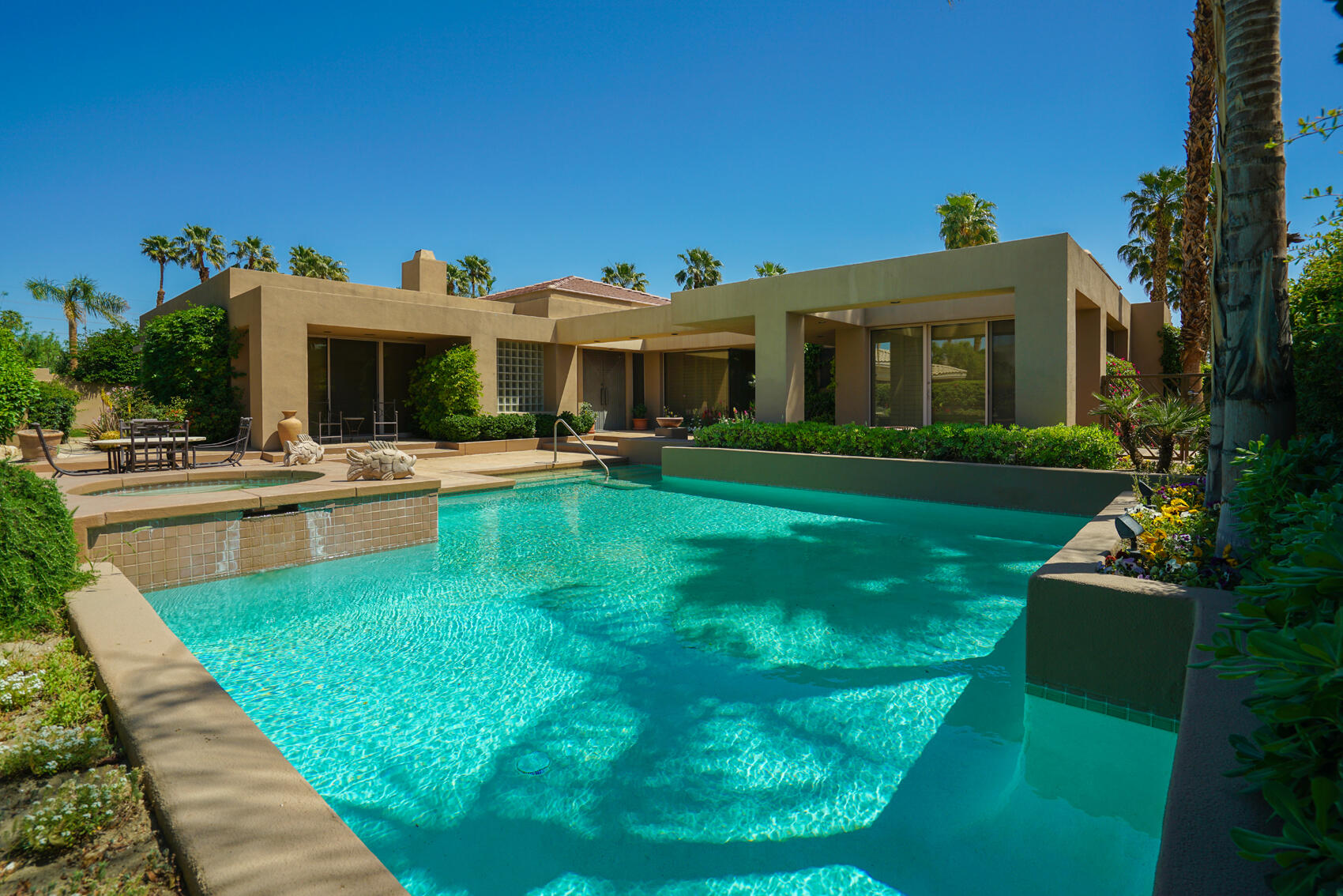 79140 Jack Rabbit Trail La Quinta, CA 92253 - Photo 1 of 61 a view of a house with a backyard porch and sitting area
