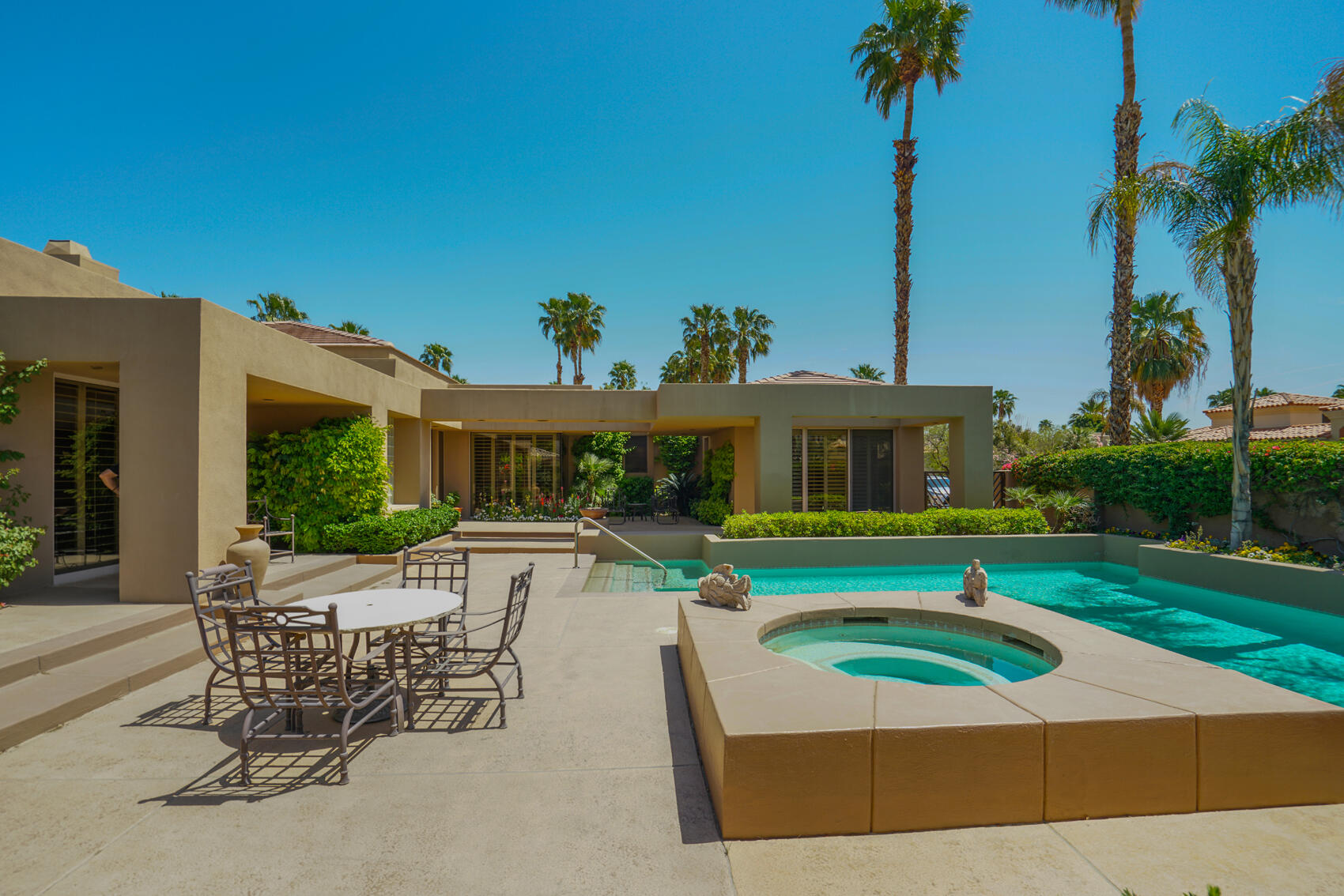 79140 Jack Rabbit Trail La Quinta, CA 92253 - Photo 13 of 61 a view of a house with garden and a patio