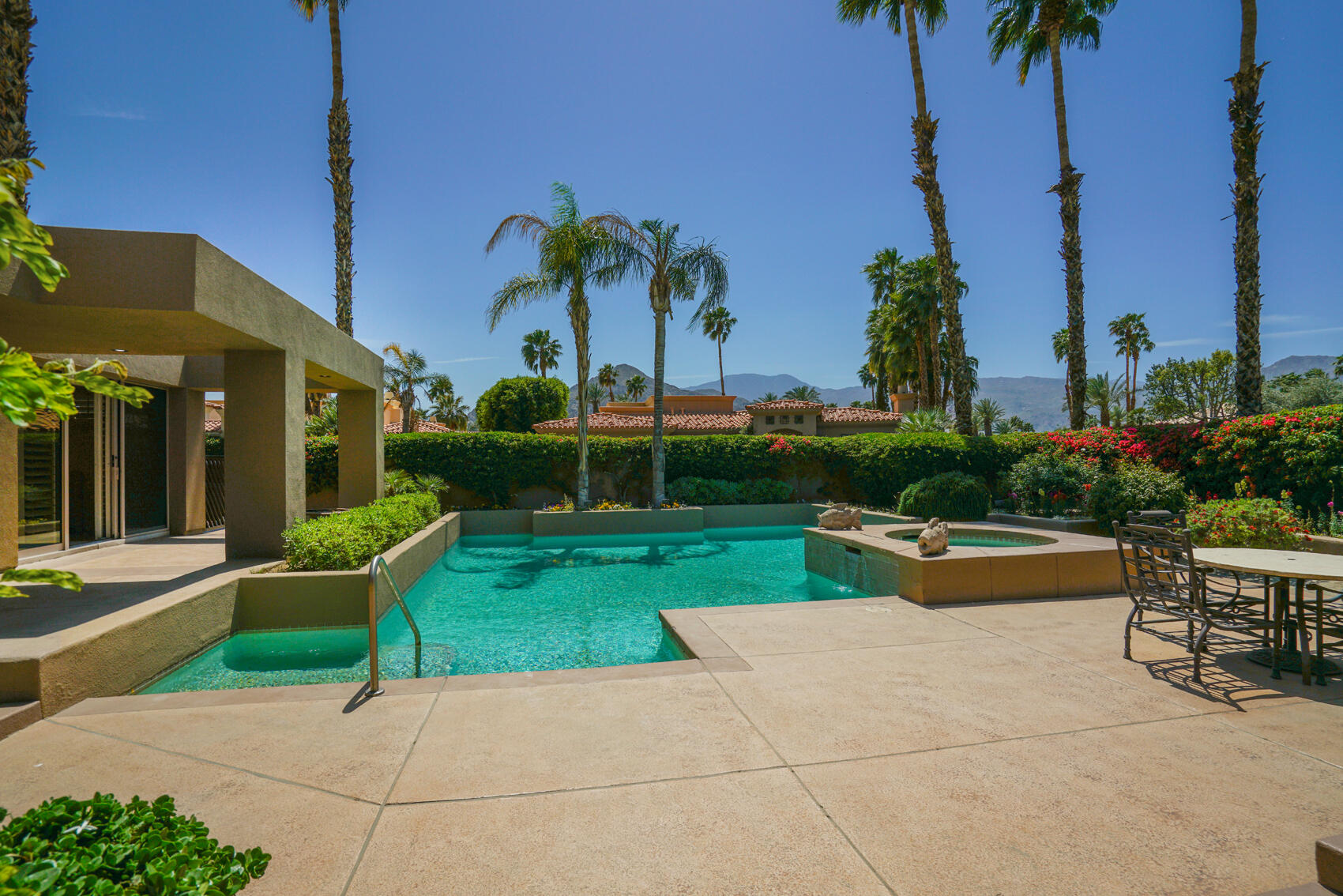 79140 Jack Rabbit Trail La Quinta, CA 92253 - Photo 15 of 61 a view of a patio with a table and chairs