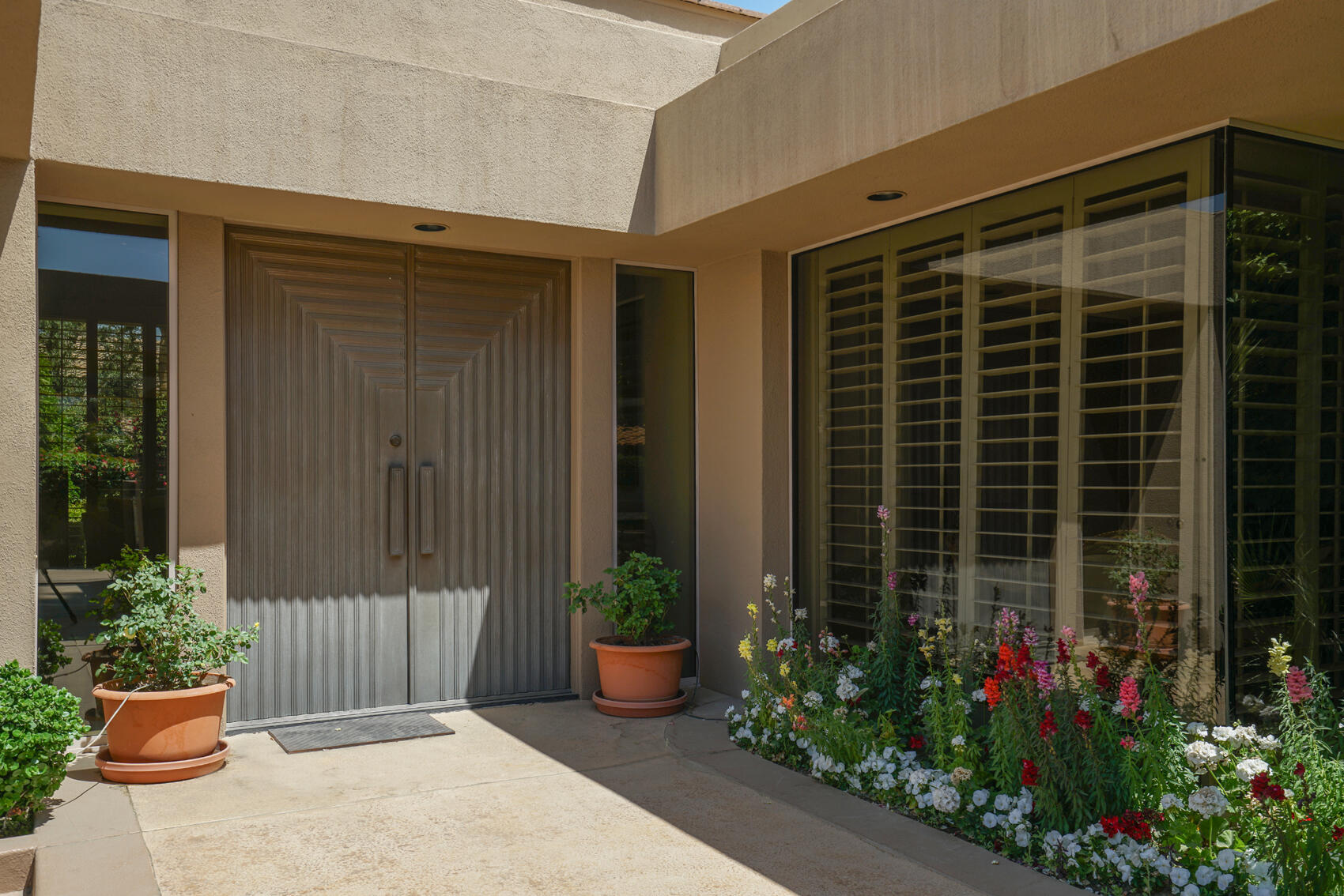 79140 Jack Rabbit Trail La Quinta, CA 92253 - Photo 17 of 61 a view of a house with potted plants