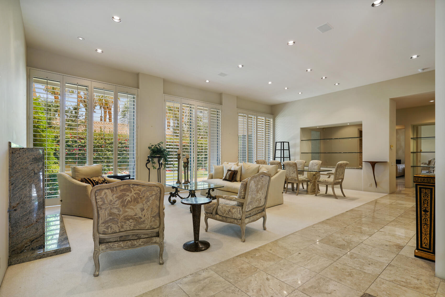 79140 Jack Rabbit Trail La Quinta, CA 92253 - Photo 20 of 61 a living room with fireplace furniture and floor to ceiling window