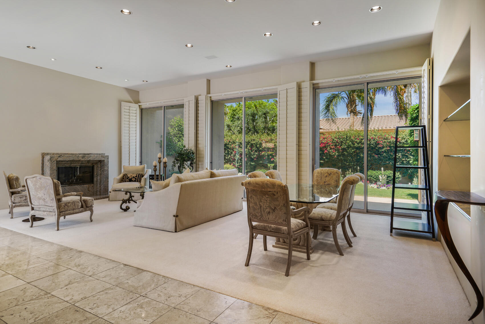 79140 Jack Rabbit Trail La Quinta, CA 92253 - Photo 21 of 61 a living room with furniture and large windows