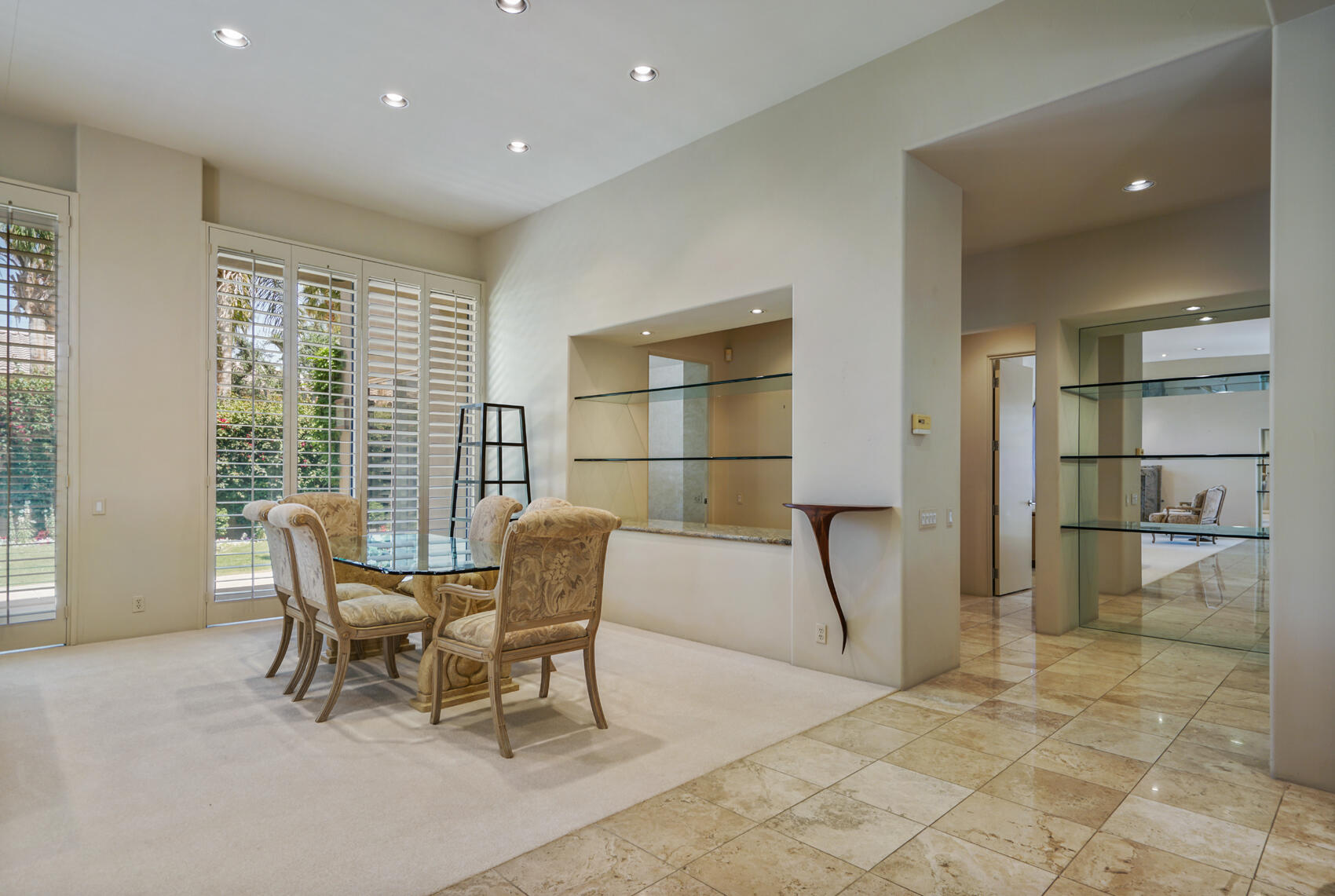 79140 Jack Rabbit Trail La Quinta, CA 92253 - Photo 23 of 61 a dining room with furniture and a floor to ceiling window