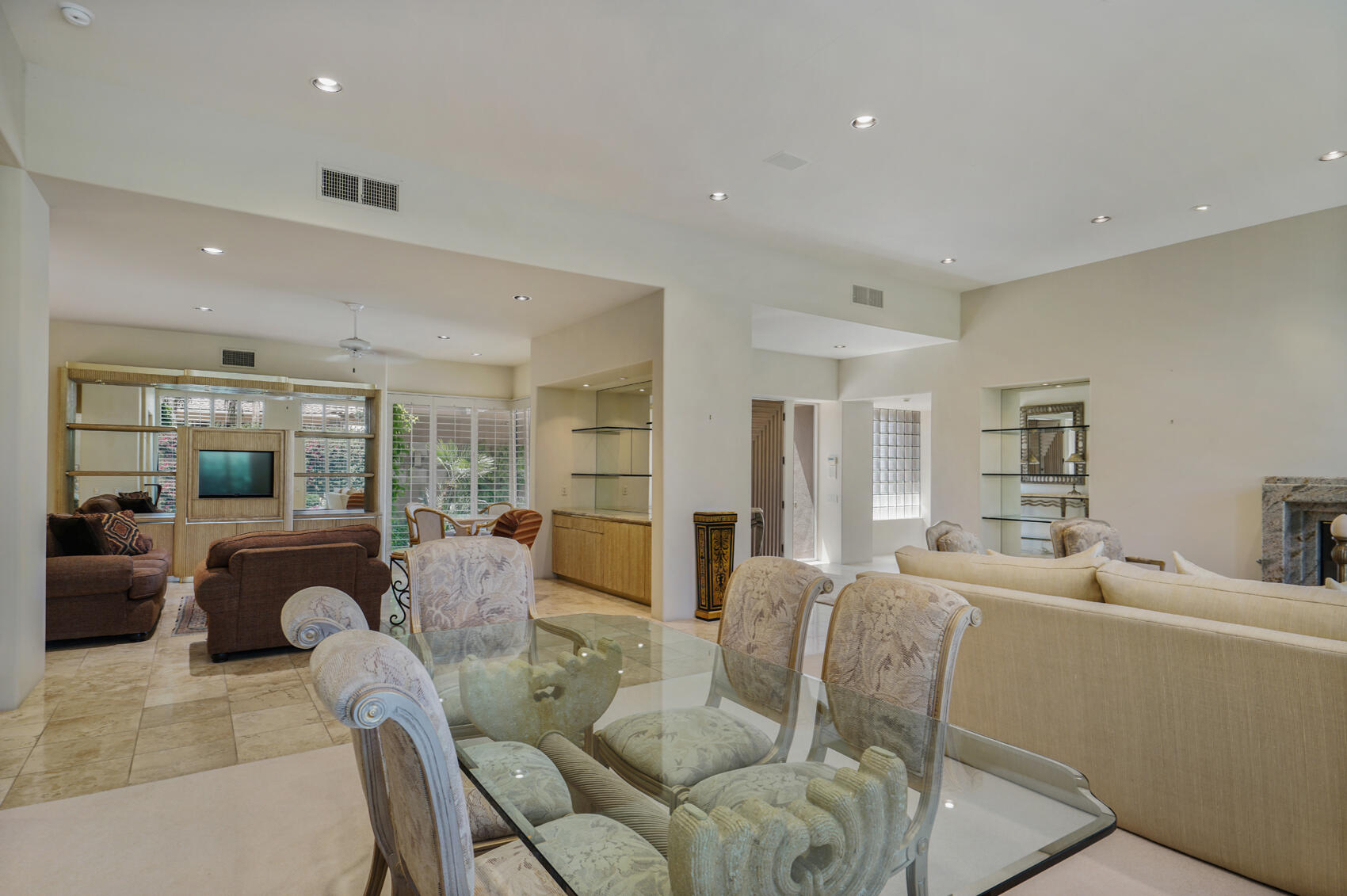 79140 Jack Rabbit Trail La Quinta, CA 92253 - Photo 24 of 61 a living room with furniture large window and wooden floor