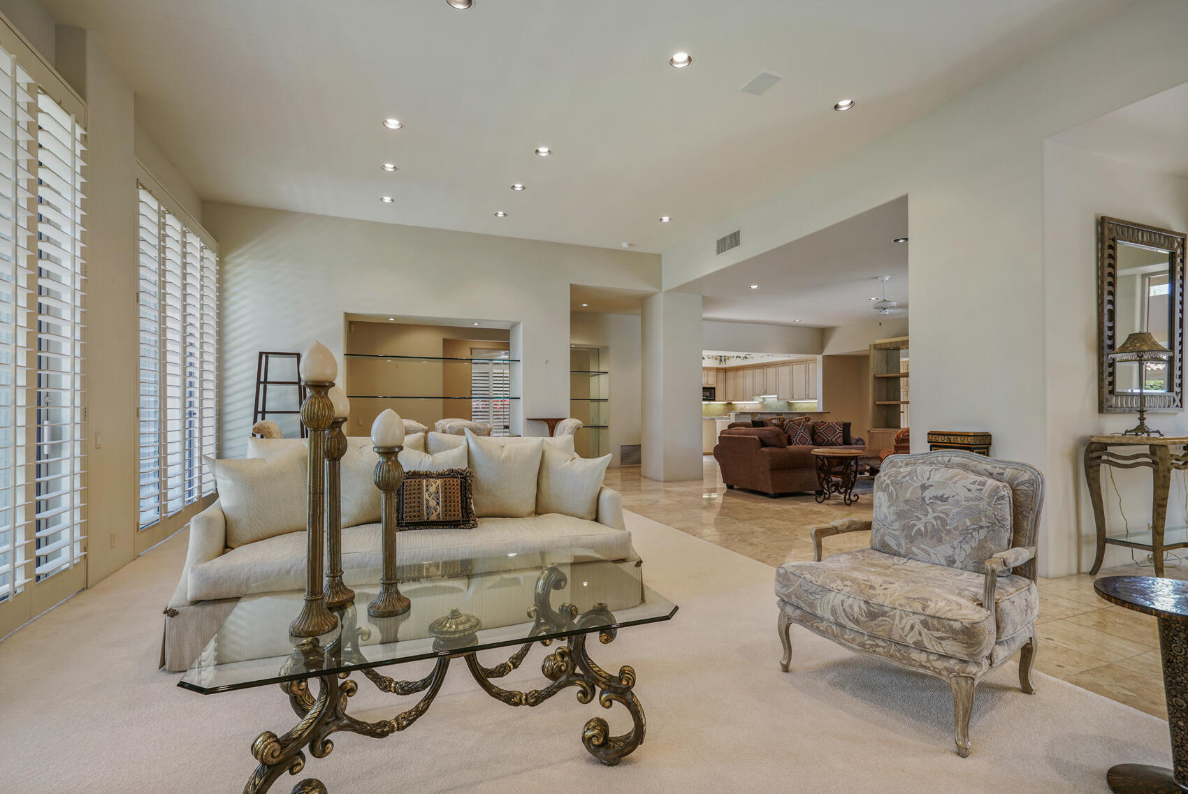 79140 Jack Rabbit Trail La Quinta, CA 92253 - Photo 25 of 61 a living room with furniture and a large window