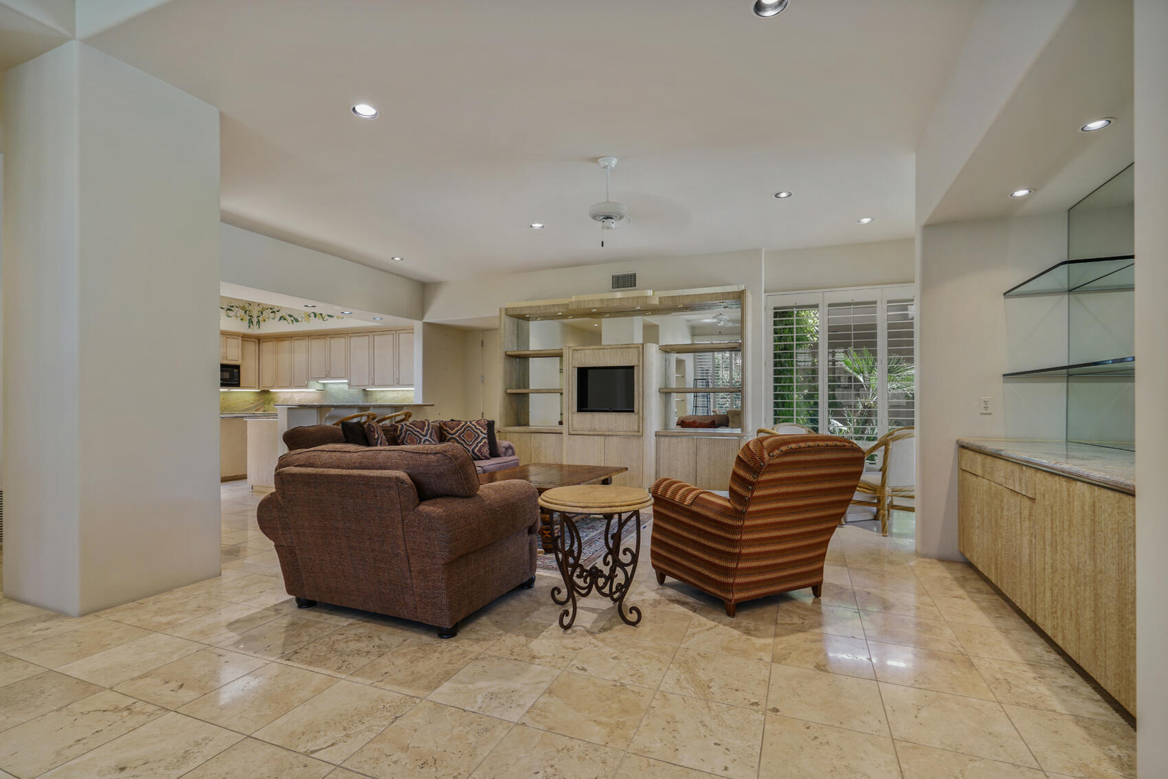 79140 Jack Rabbit Trail La Quinta, CA 92253 - Photo 31 of 61 a living room with furniture and a kitchen