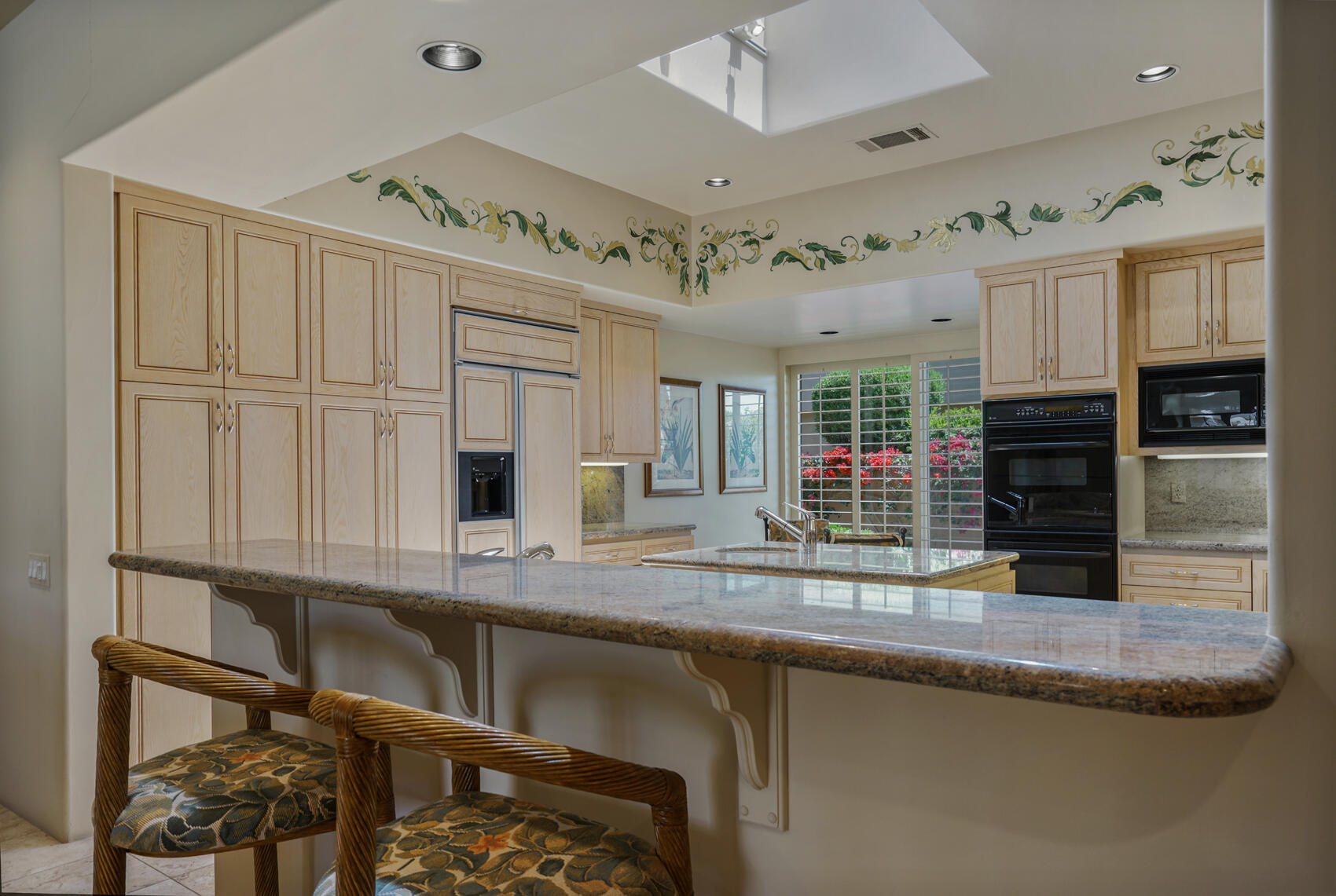 79140 Jack Rabbit Trail La Quinta, CA 92253 - Photo 33 of 61 a kitchen with stainless steel appliances granite countertop a sink and cabinets