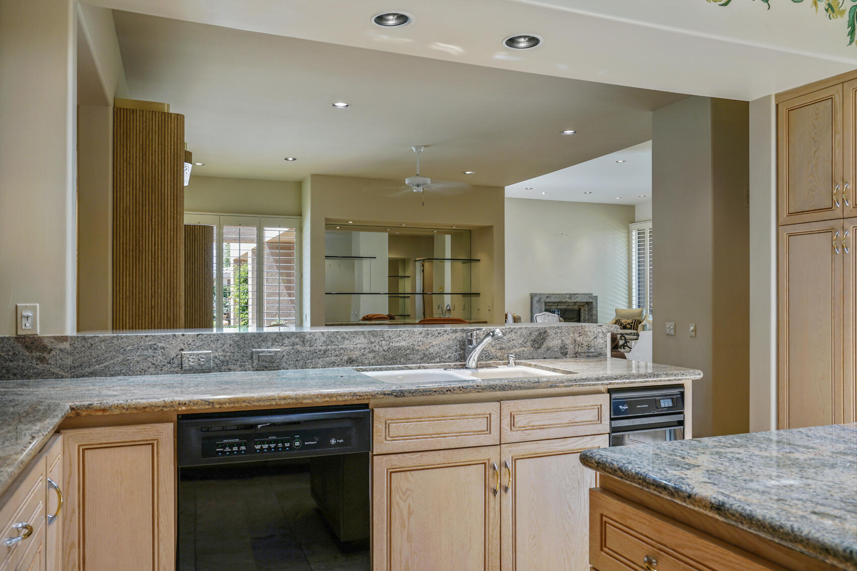 79140 Jack Rabbit Trail La Quinta, CA 92253 - Photo 34 of 61 a bathroom with a granite countertop sink and a mirror