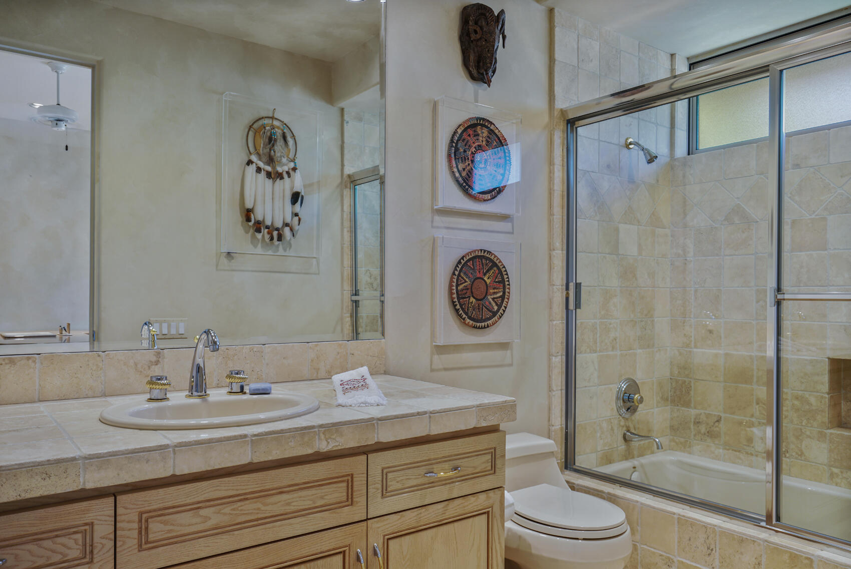 79140 Jack Rabbit Trail La Quinta, CA 92253 - Photo 48 of 61 a bathroom with a granite countertop sink mirror a vanity and a shower