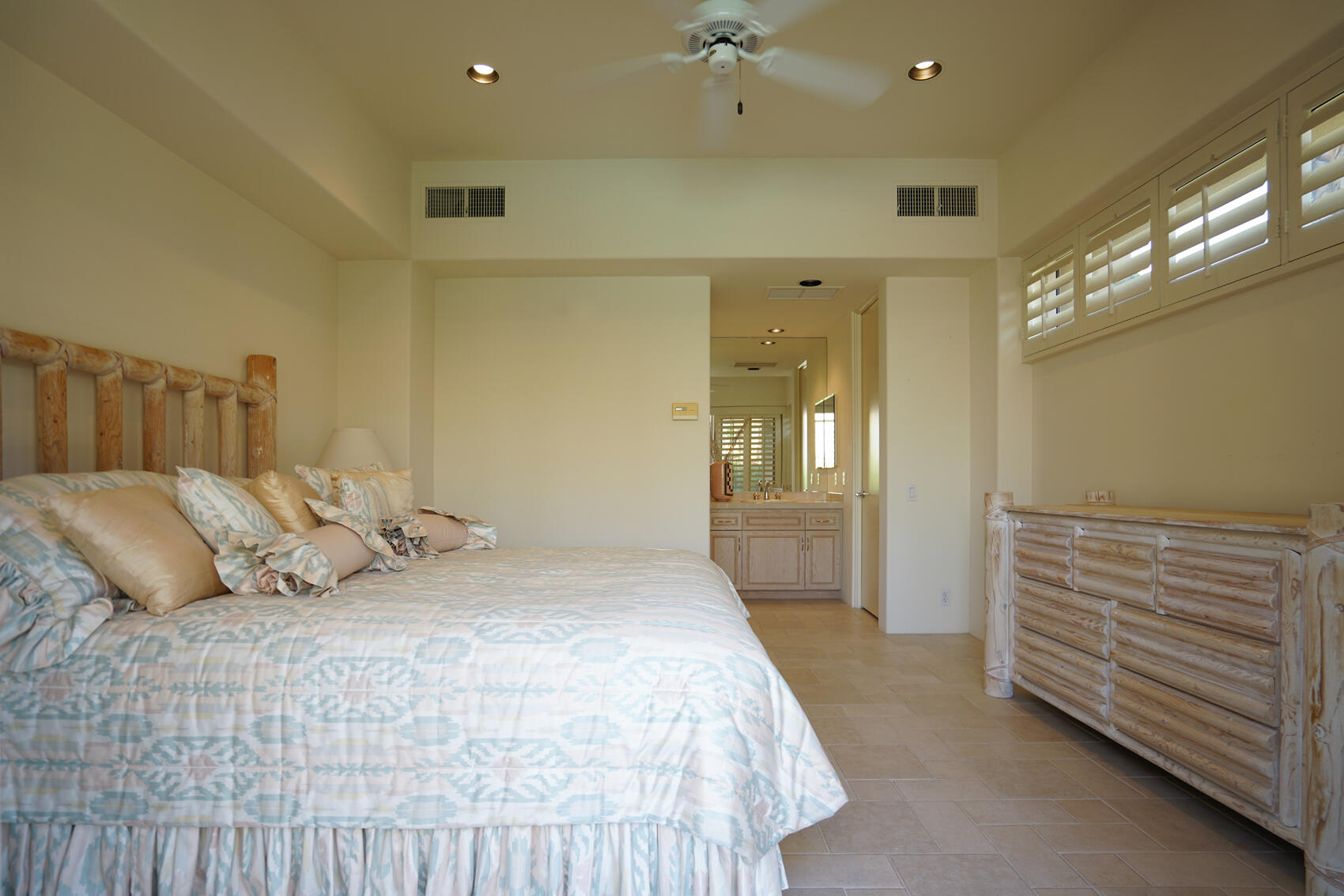 79140 Jack Rabbit Trail La Quinta, CA 92253 - Photo 53 of 61 a bedroom with a bed and a chandelier
