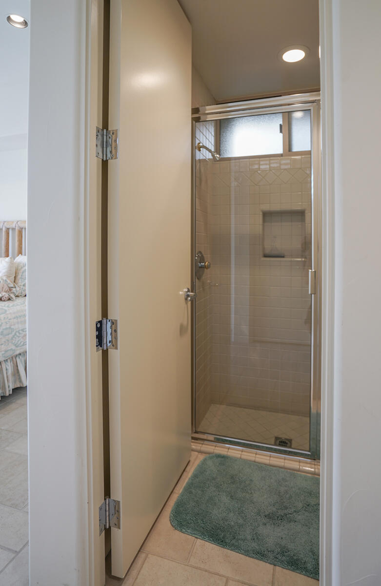 79140 Jack Rabbit Trail La Quinta, CA 92253 - Photo 54 of 61 a bathroom with a glass shower door