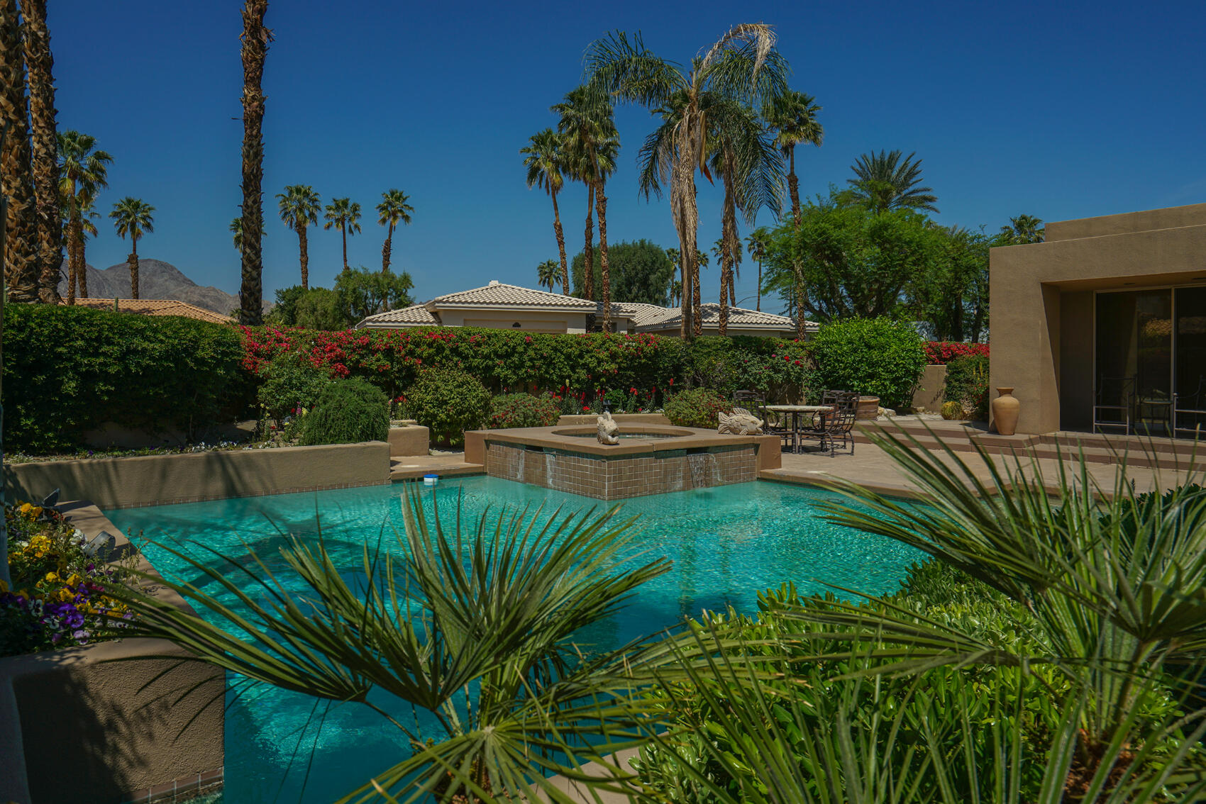 79140 Jack Rabbit Trail La Quinta, CA 92253 - Photo 9 of 61 a view of a backyard house and swimming pool