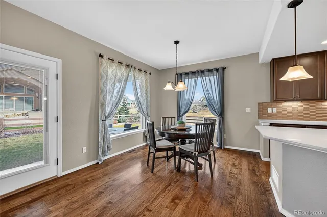 a open kitchen with stainless steel appliances kitchen island a refrigerator sink and cabinets