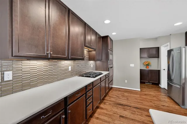 a kitchen with lots of counter space and sink