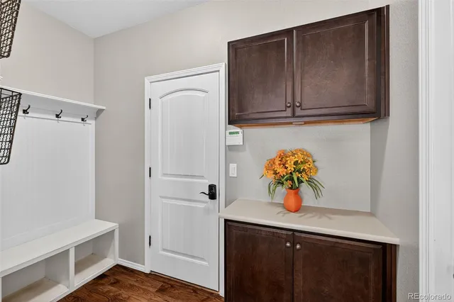 a view of a livingroom with a ceiling fan & window