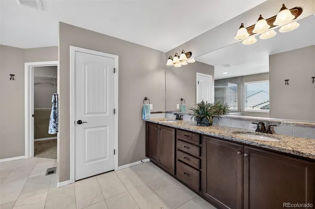 a view of a big room with a ceiling fan and a window