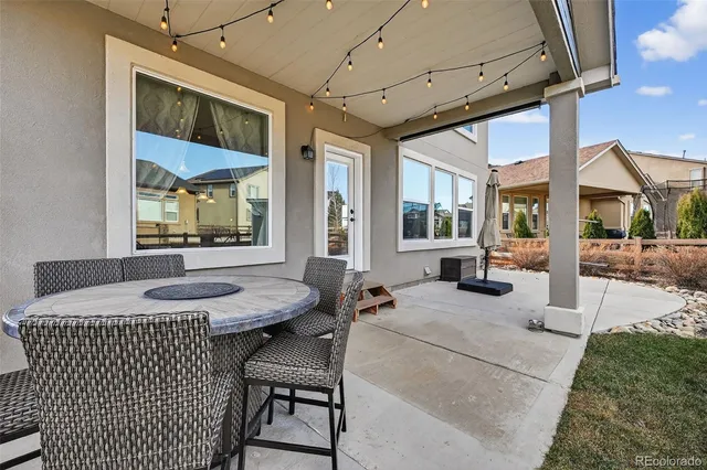 a view of a house with backyard and porch