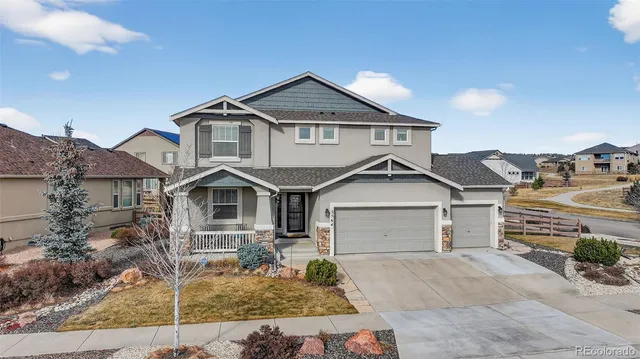 a view of an entryway with wooden floor and staircase