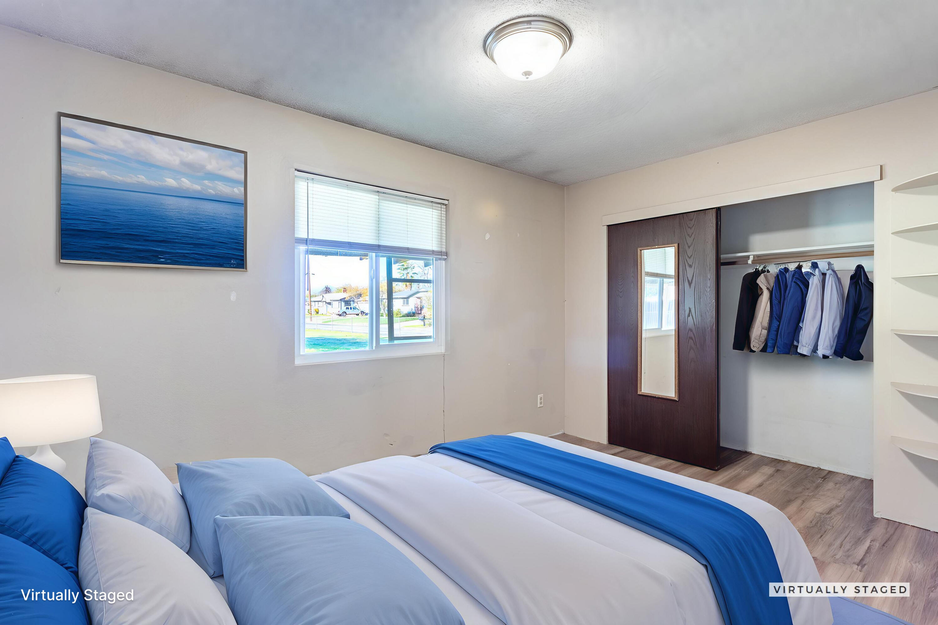 6874 Weeks Road Redding, CA 96002 - Photo 15 of 26 a bedroom with a bed and window