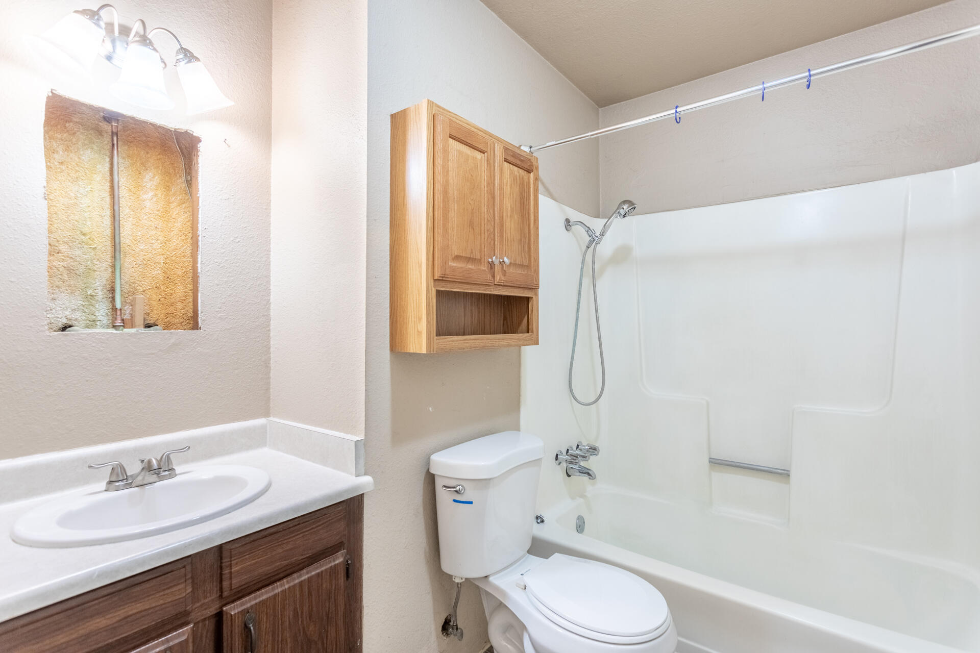 6874 Weeks Road Redding, CA 96002 - Photo 17 of 26 a bathroom with a granite countertop toilet sink and shower