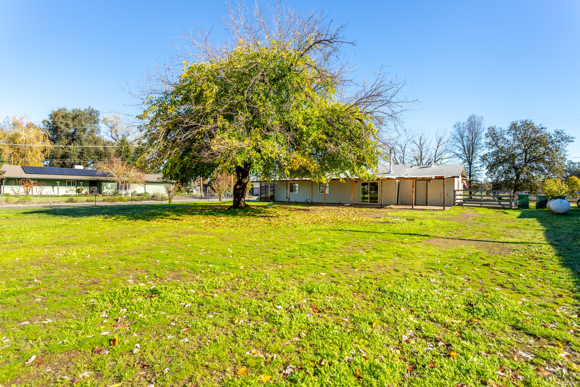 6874 Weeks Road Redding, CA 96002 - Photo 19 of 26 a view of a swimming pool with an outdoor space and seating area