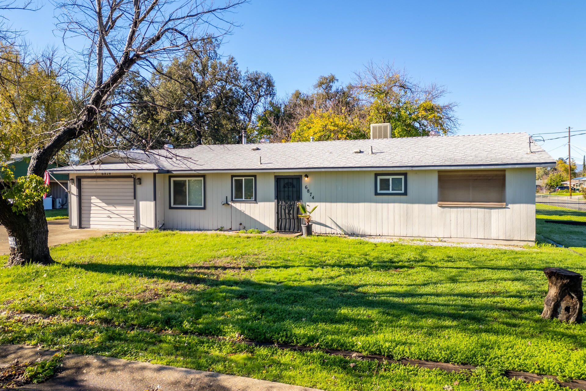 6874 Weeks Road Redding, CA 96002 - Photo 2 of 26 a view of a house with backyard