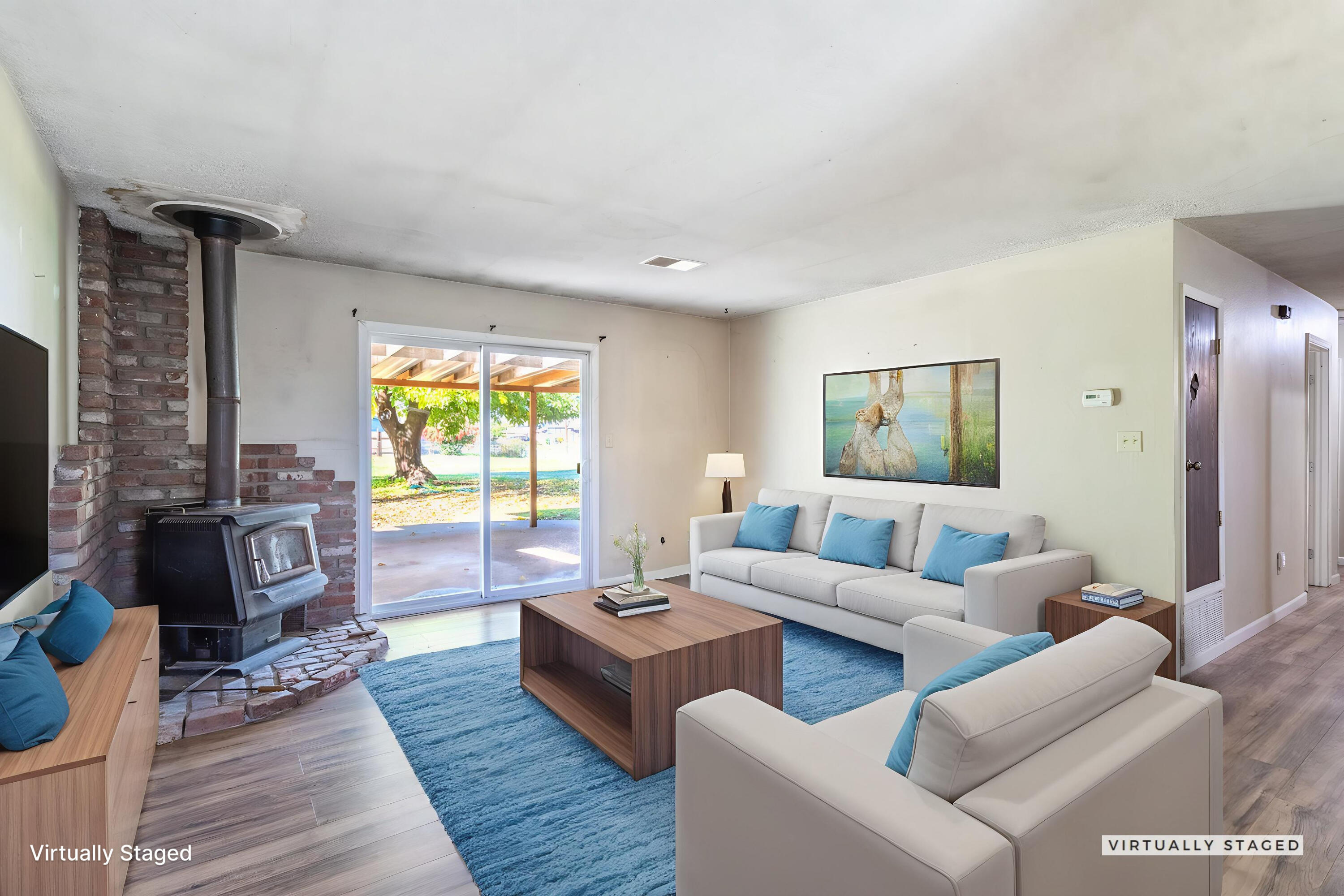 6874 Weeks Road Redding, CA 96002 - Photo 4 of 26 a living room with furniture and a large window