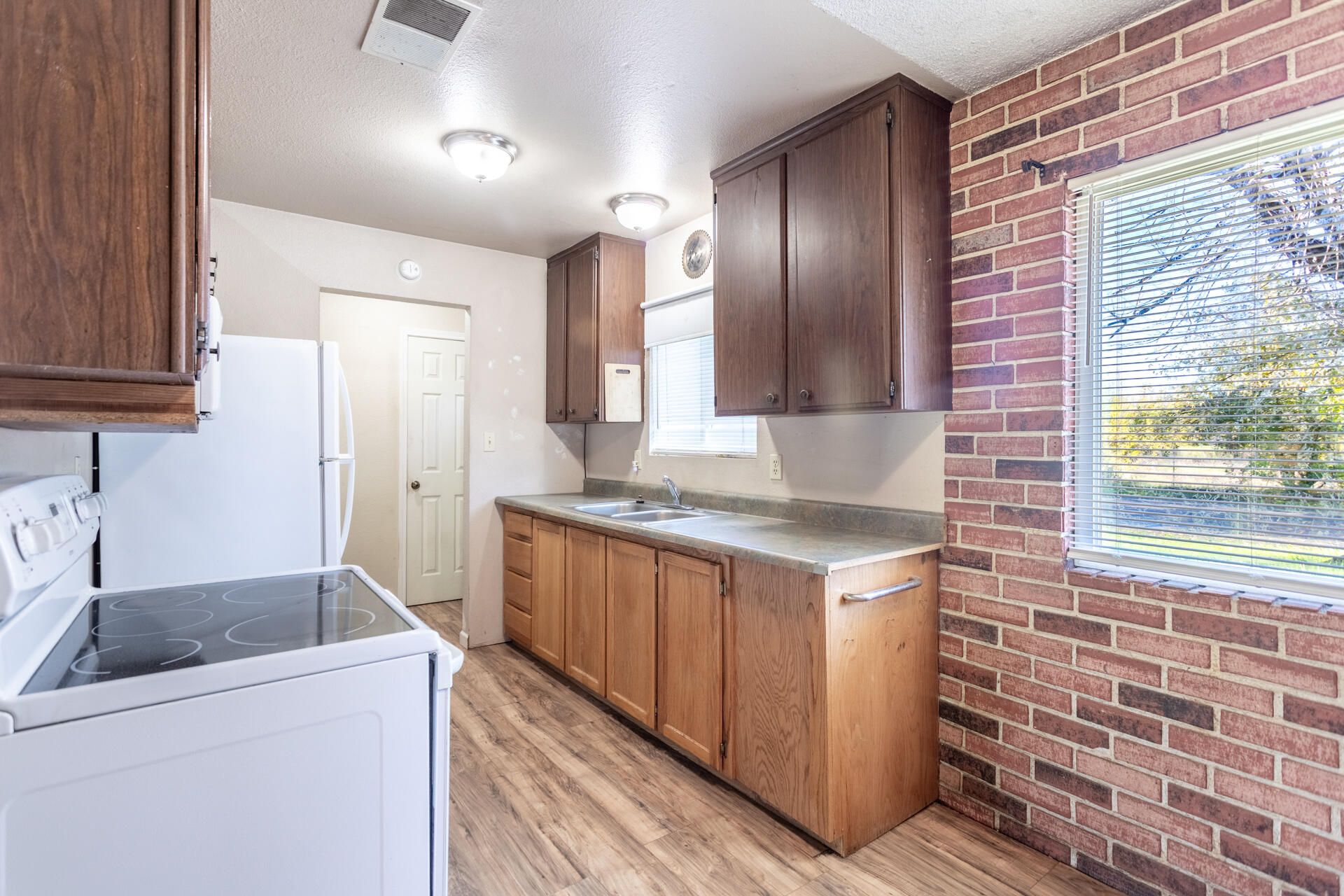 6874 Weeks Road Redding, CA 96002 - Photo 6 of 26 a kitchen with a stove and a sink