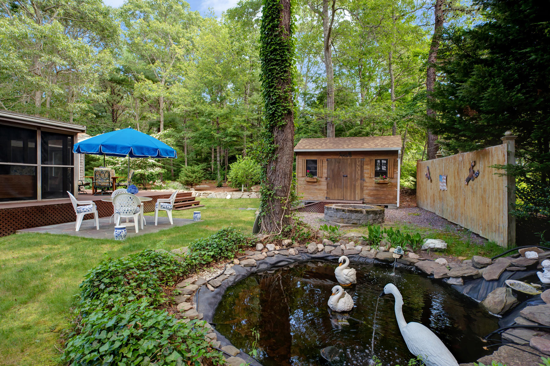 18 Frederick Road Falmouth, MA 02540 - Photo 16 of 62 a view of a house with backyard sitting area and garden