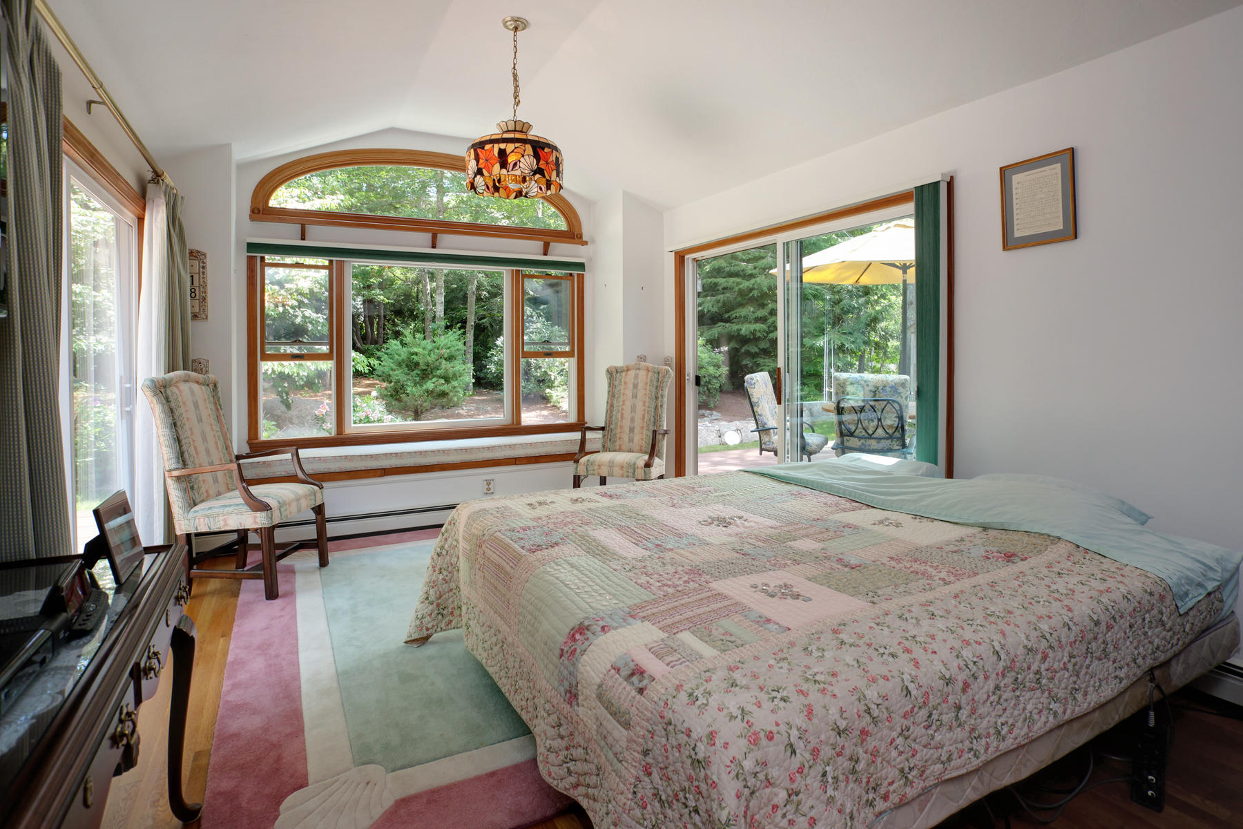 18 Frederick Road Falmouth, MA 02540 - Photo 17 of 62 a bed sitting in a bedroom next to a window