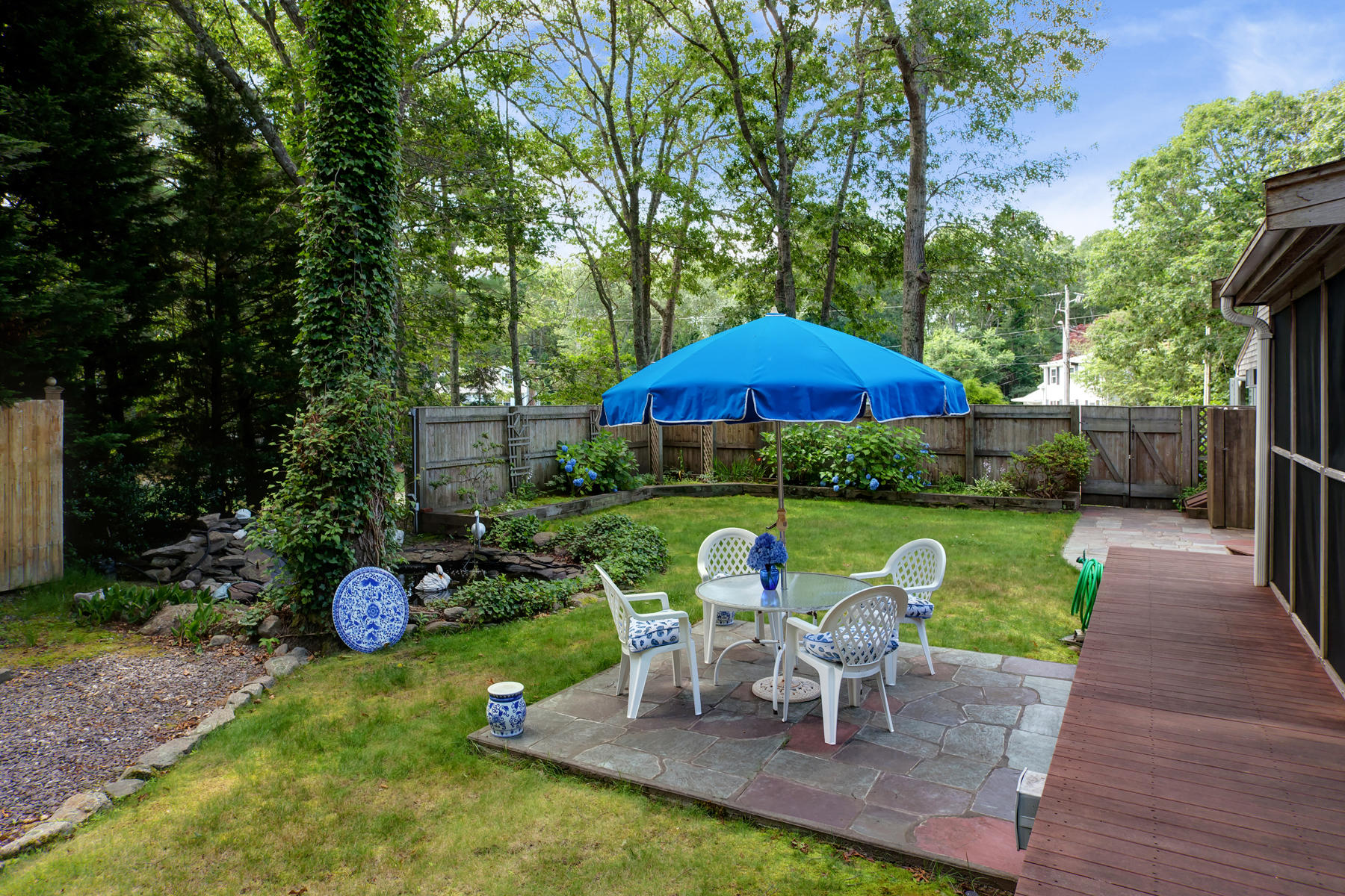 18 Frederick Road Falmouth, MA 02540 - Photo 31 of 62 a view of a table and chairs under an umbrella