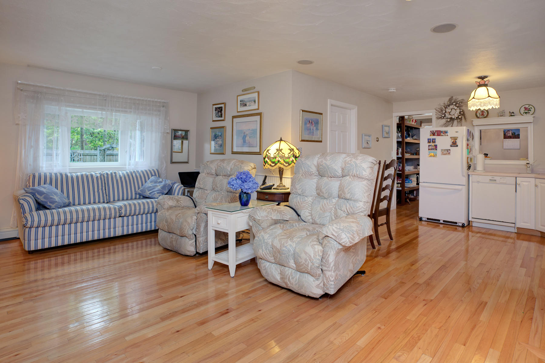 18 Frederick Road Falmouth, MA 02540 - Photo 38 of 62 a living room with furniture and a wooden floor