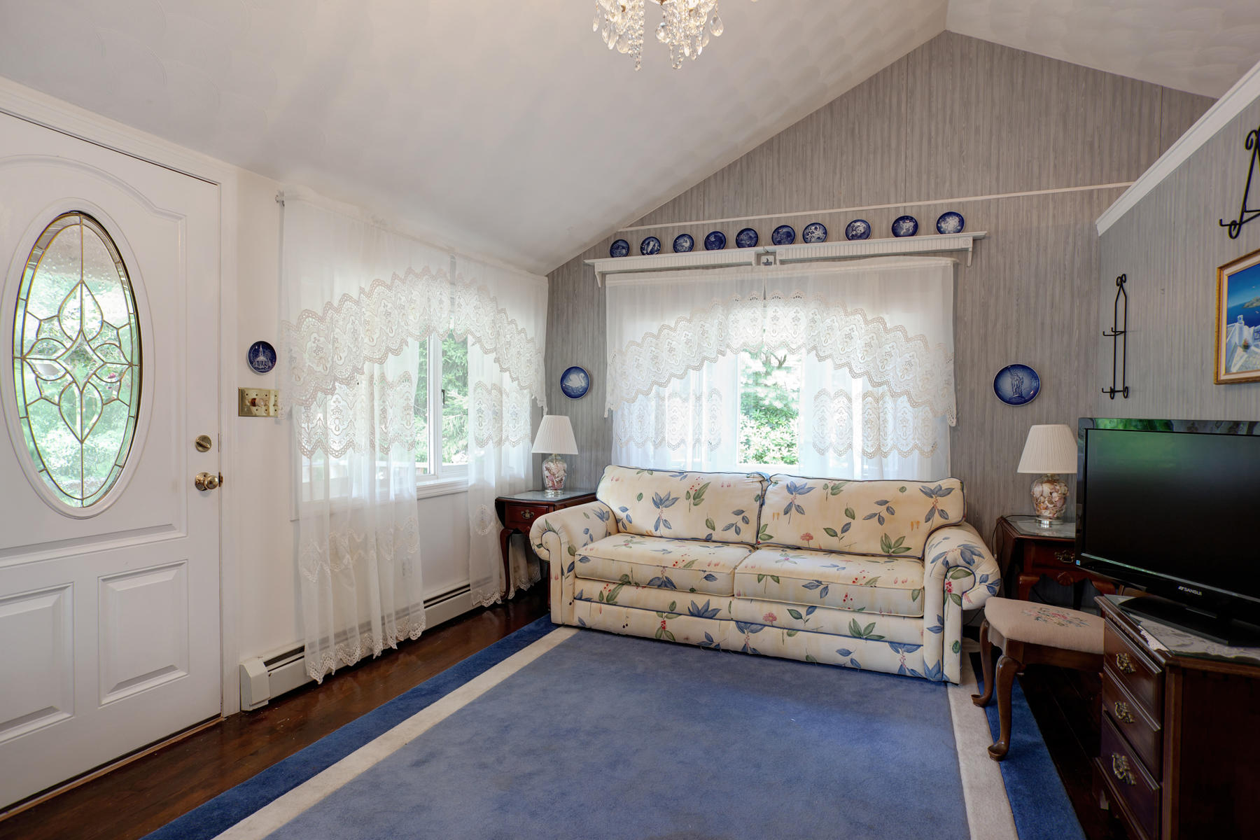 18 Frederick Road Falmouth, MA 02540 - Photo 46 of 62 a living room with furniture a flat screen tv and a window