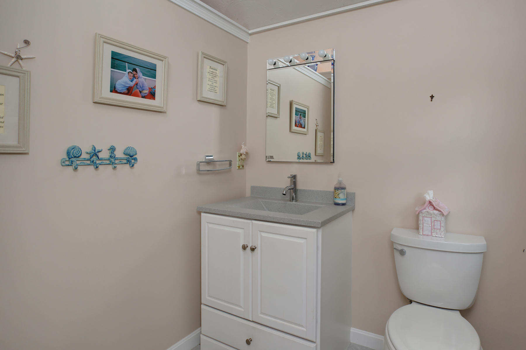 18 Frederick Road Falmouth, MA 02540 - Photo 48 of 62 a bathroom with a toilet a sink and mirror
