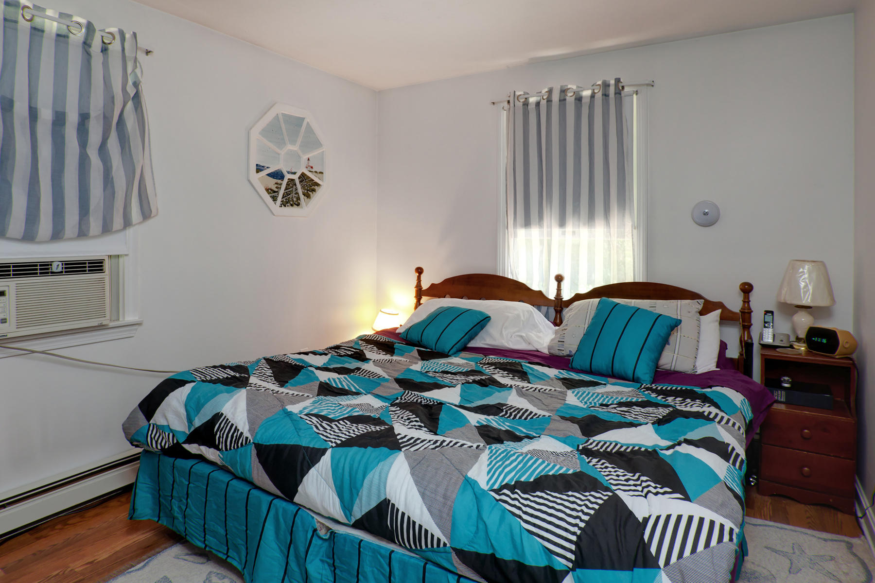 18 Frederick Road Falmouth, MA 02540 - Photo 50 of 62 a bedroom with two beds and a chandelier