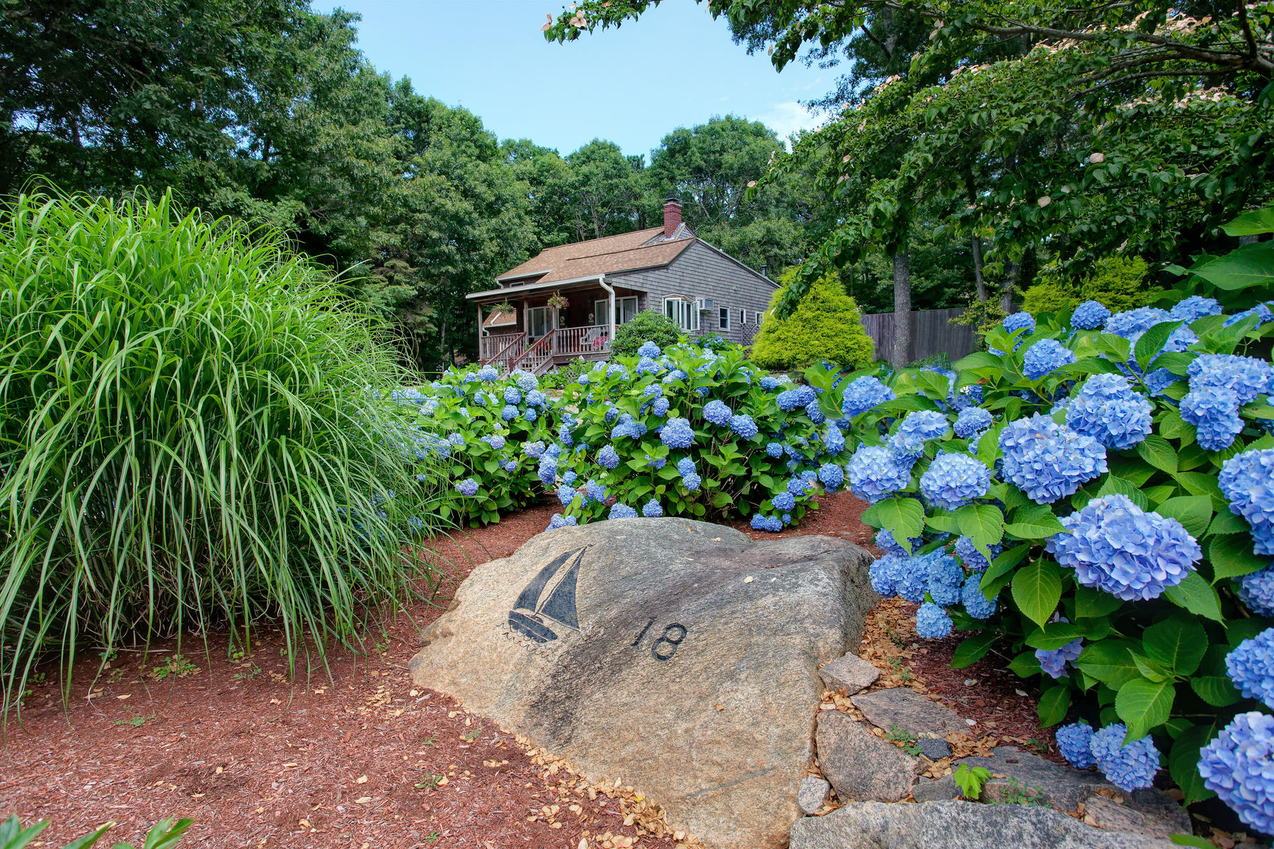 18 Frederick Road Falmouth, MA 02540 - Photo 55 of 62 a view of a house with a yard and garden