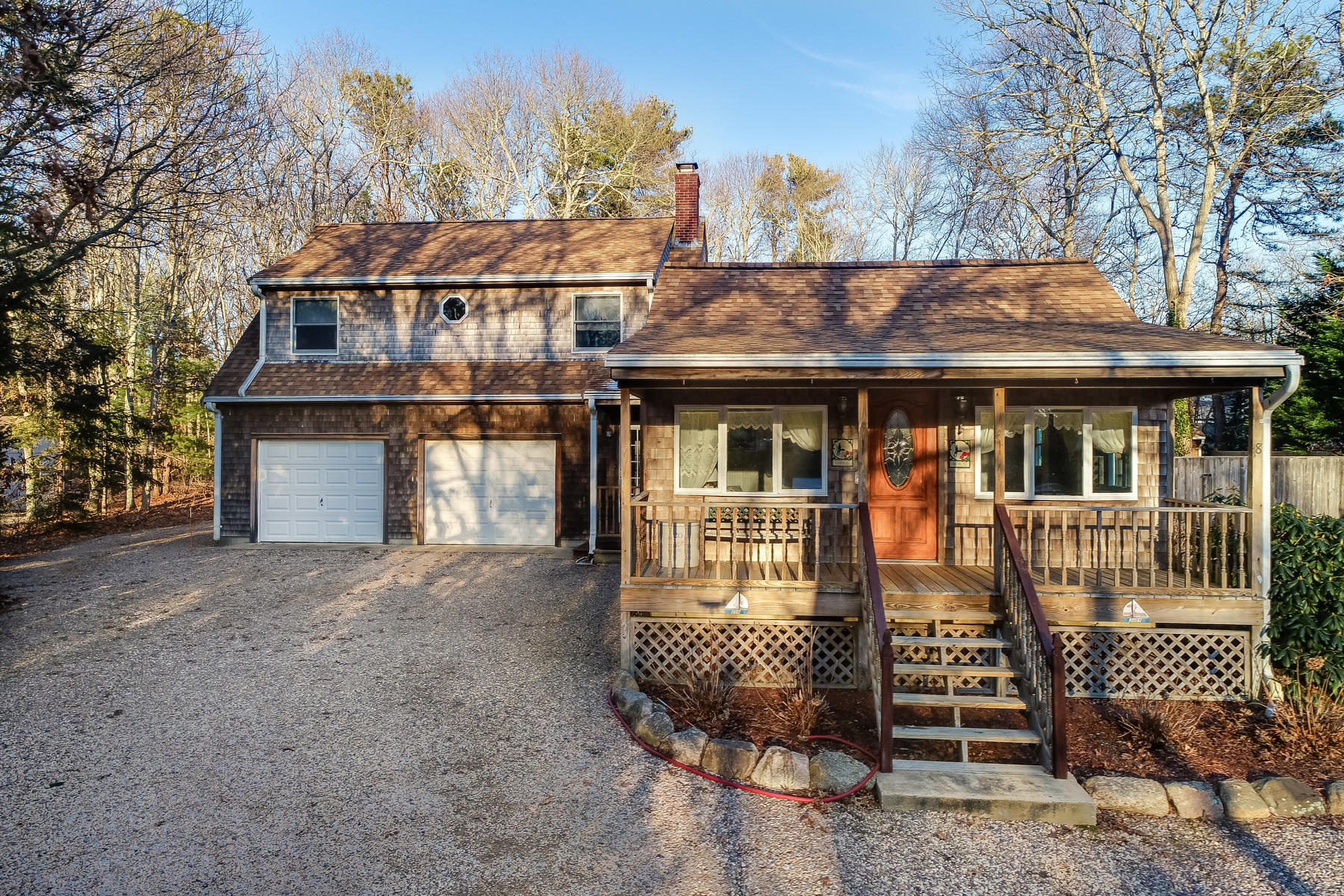 18 Frederick Road Falmouth, MA 02540 - Photo 58 of 62 a front view of a house with a garden