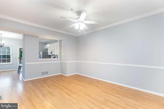 1323 Roman Ridge Way Bel Air, MD 21014 - Photo 19 of 22 Living room with laminate flooring and ceiling fan