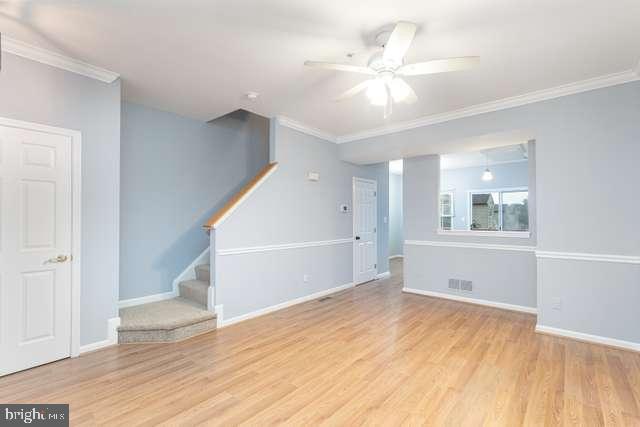 1323 Roman Ridge Way Bel Air, MD 21014 - Photo 3 of 22 Living room with laminate flooring & ceiling fan