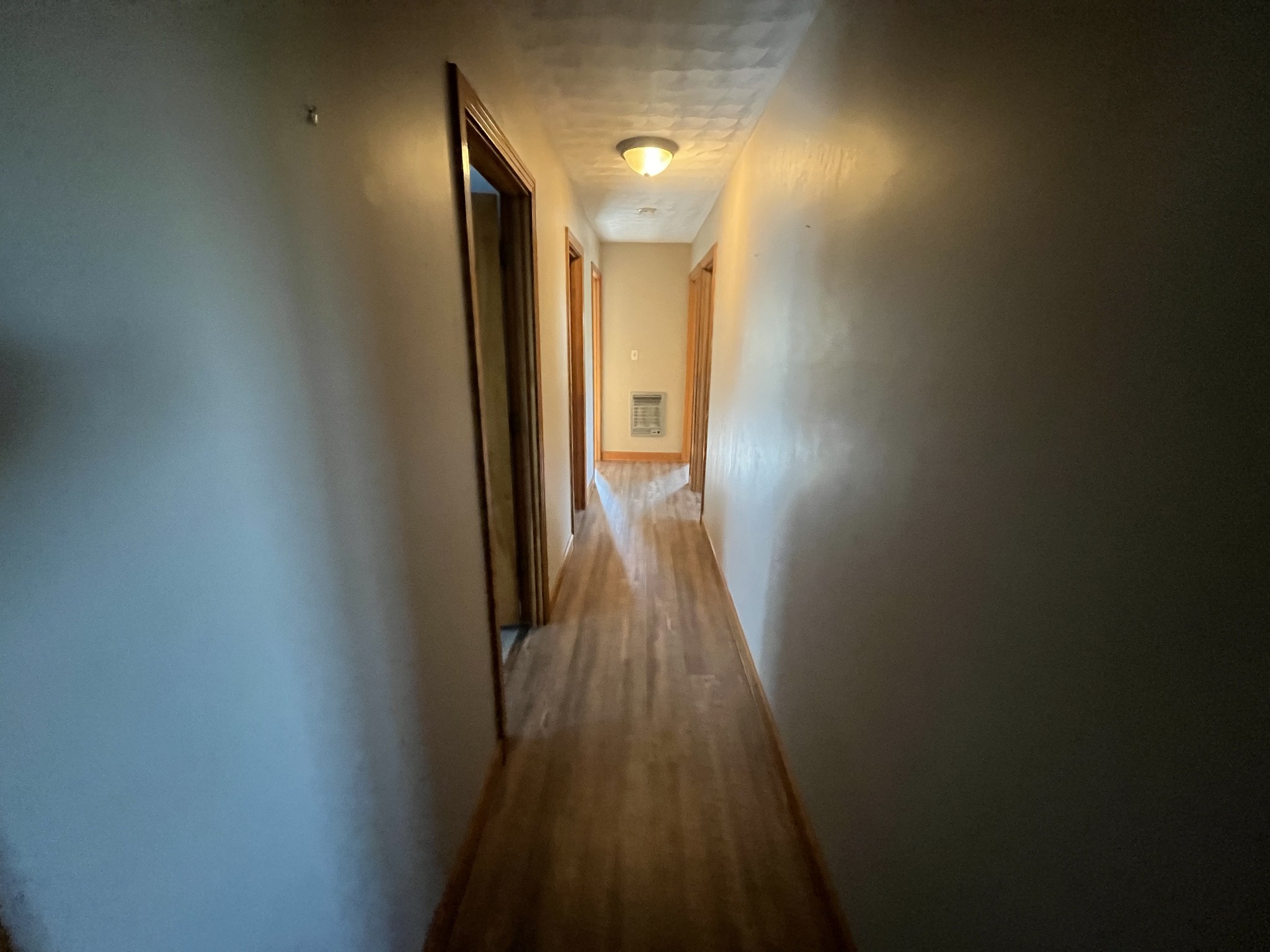 1619 Railroad Bed Road Collinwood, TN 38450 - Photo 13 of 54 a view of a hallway with wooden floor