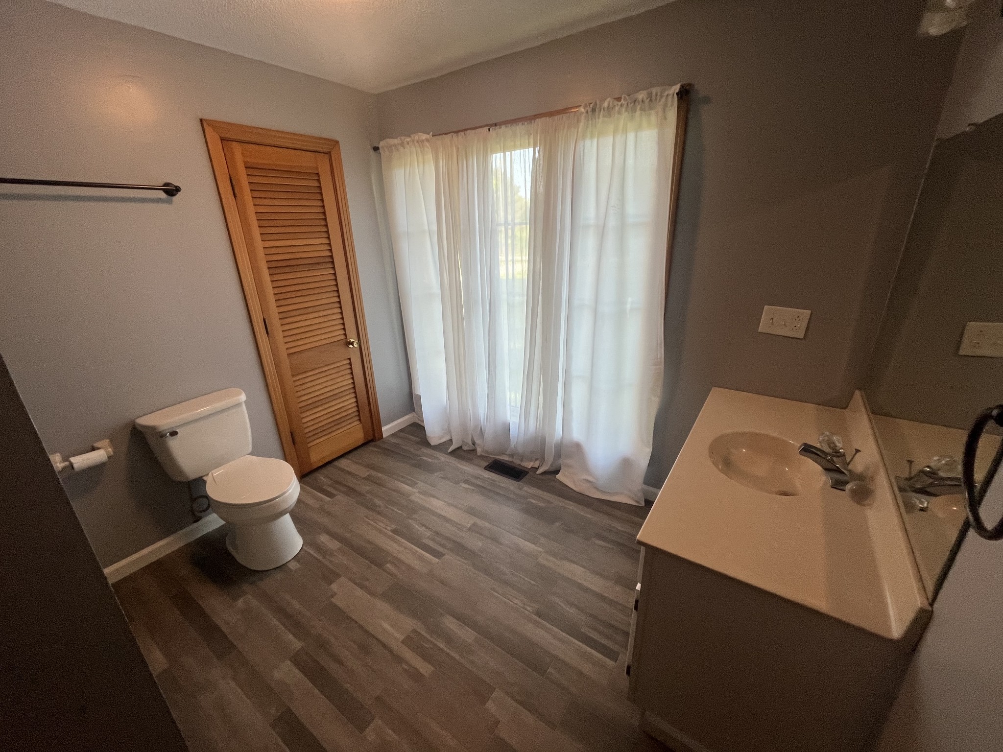 1619 Railroad Bed Road Collinwood, TN 38450 - Photo 14 of 54 a bathroom with a toilet sink and a tub