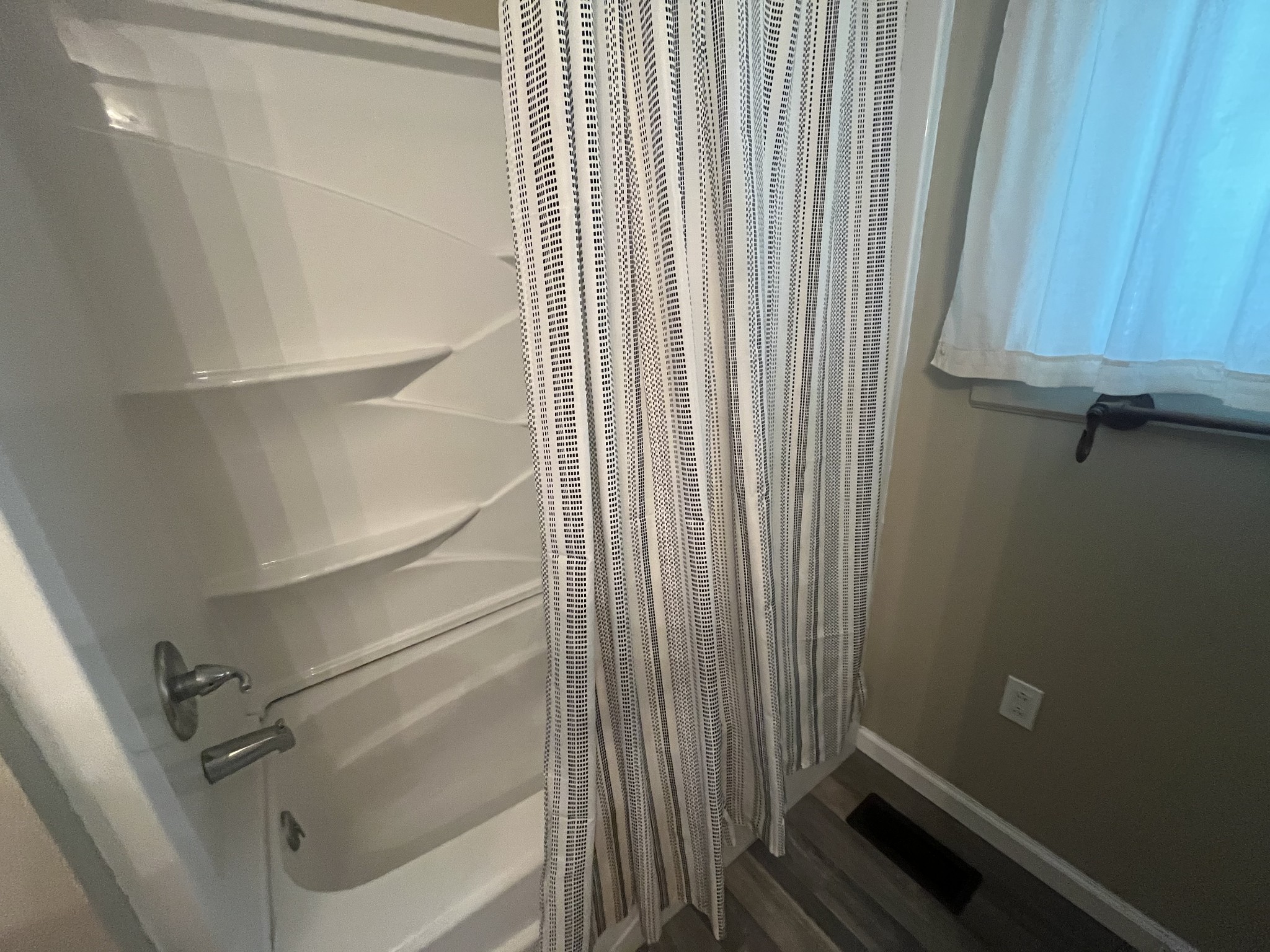 1619 Railroad Bed Road Collinwood, TN 38450 - Photo 17 of 54 a view of a room with racks on the wall