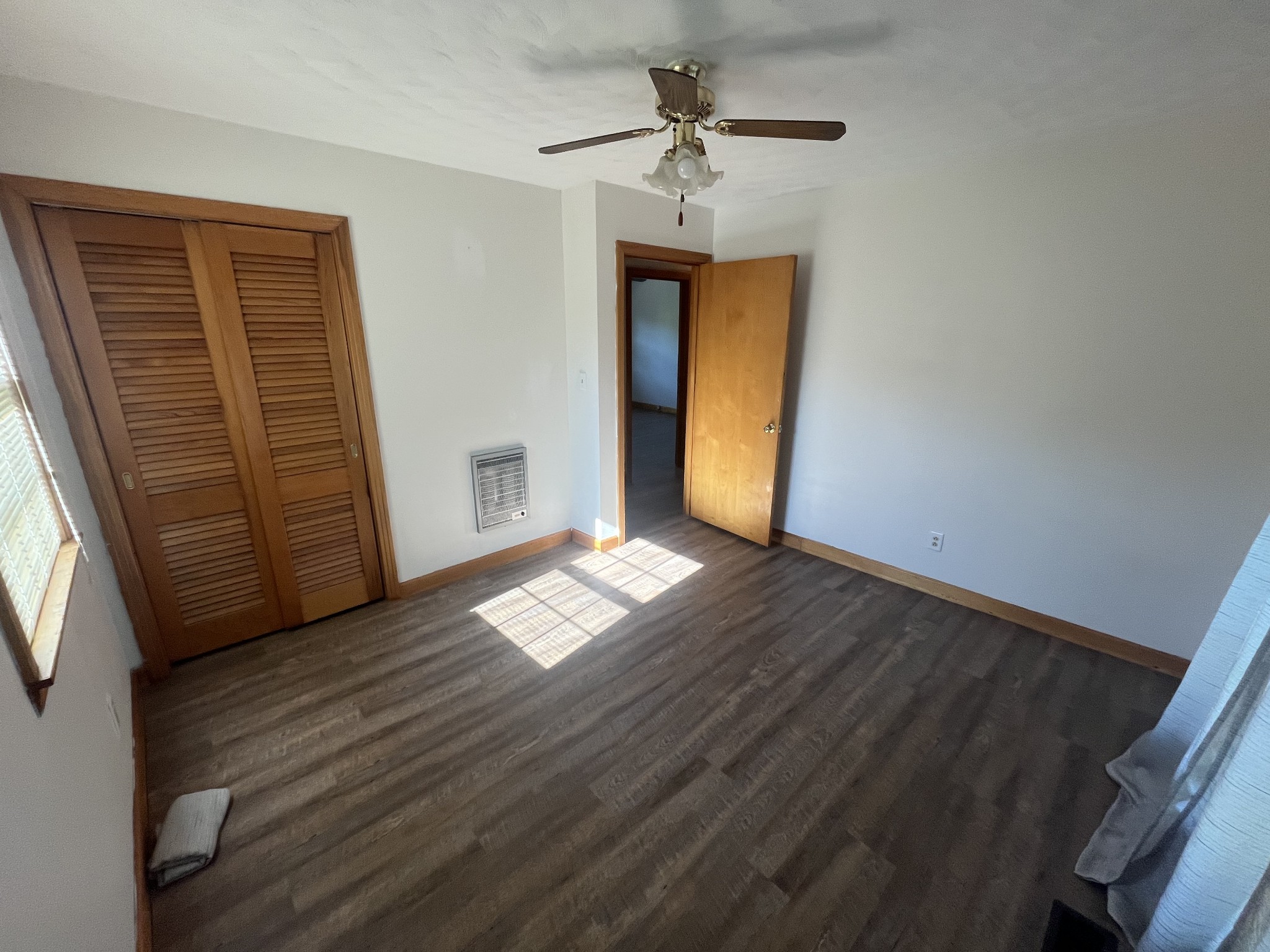 1619 Railroad Bed Road Collinwood, TN 38450 - Photo 21 of 54 a view of empty room with wooden floor and fan