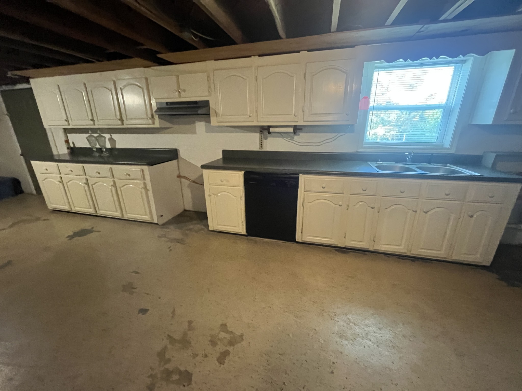 1619 Railroad Bed Road Collinwood, TN 38450 - Photo 29 of 54 a kitchen with stainless steel appliances granite countertop a sink a stove a microwave and cabinets
