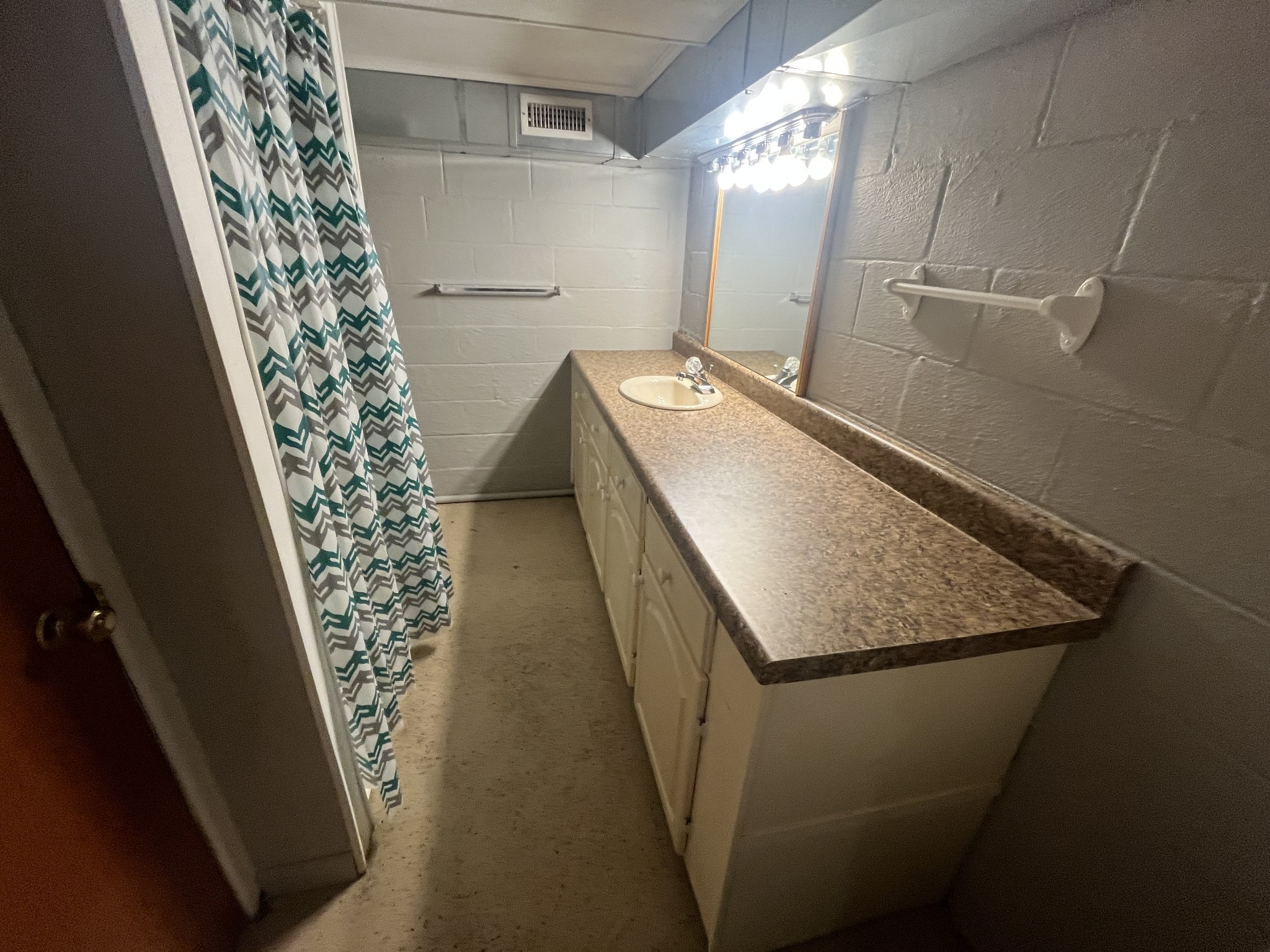 1619 Railroad Bed Road Collinwood, TN 38450 - Photo 39 of 54 a bathroom with a granite countertop sink and a mirror