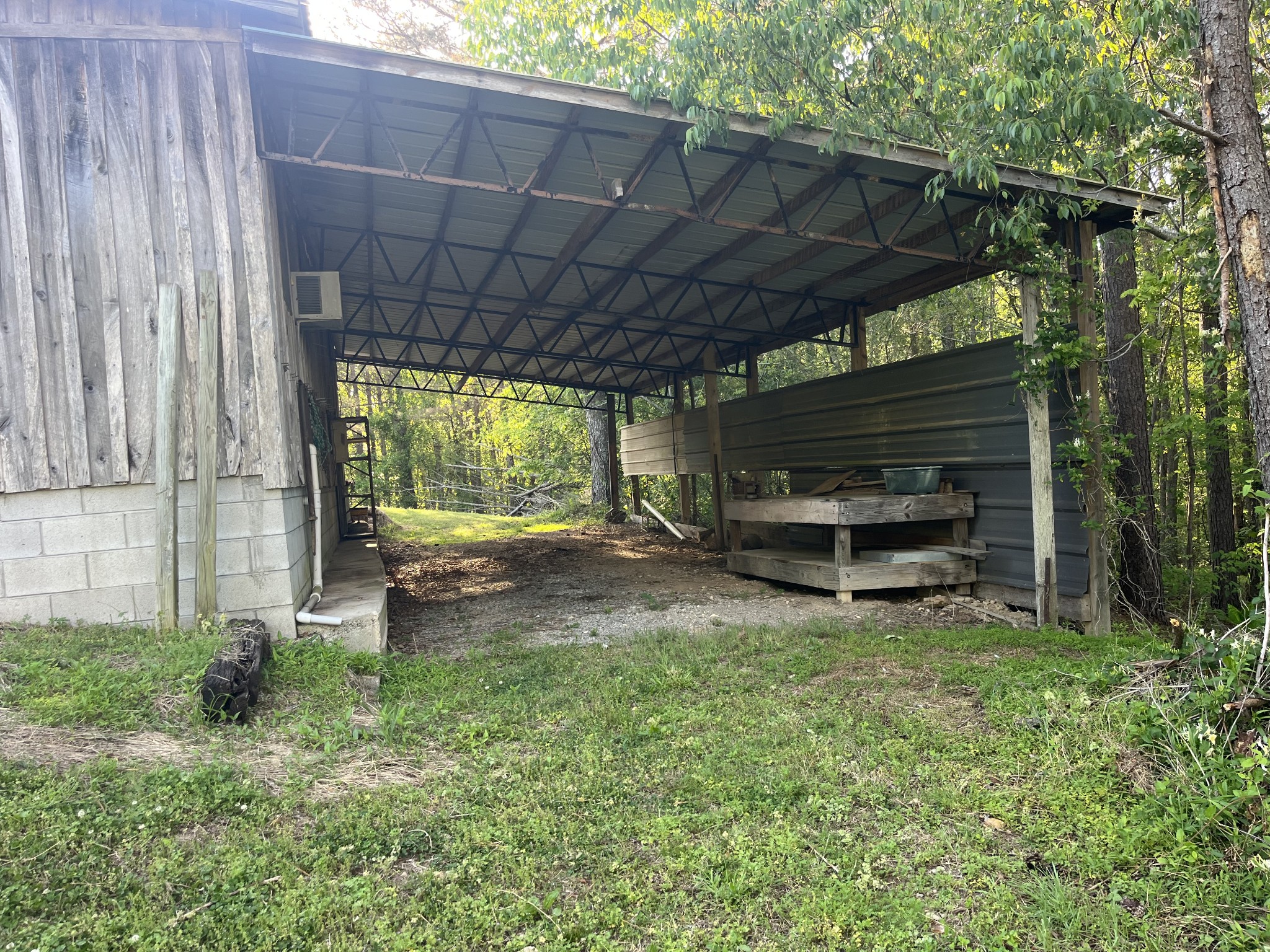 1619 Railroad Bed Road Collinwood, TN 38450 - Photo 42 of 54 a view of a backyard with a small cabin and chair
