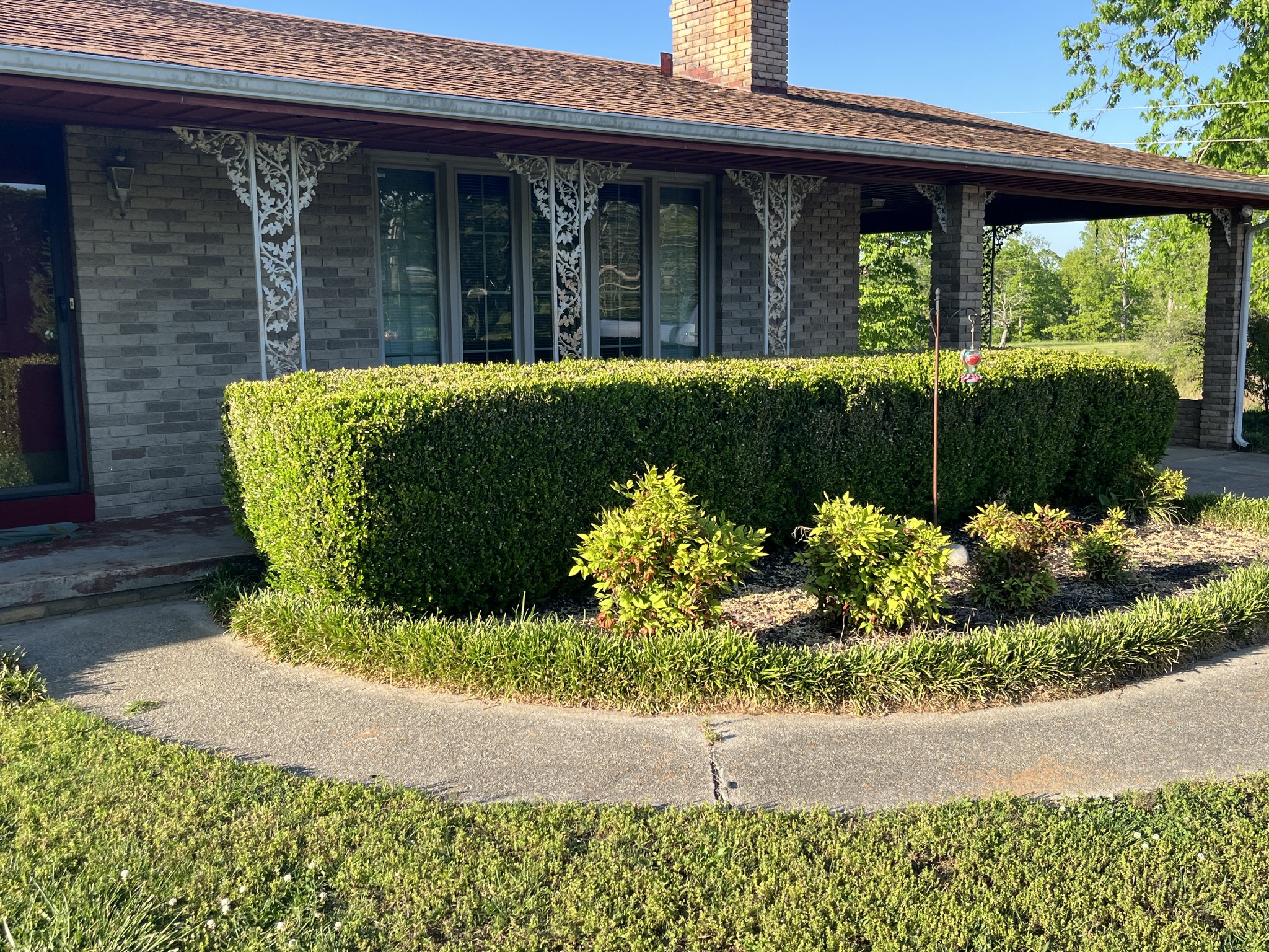 1619 Railroad Bed Road Collinwood, TN 38450 - Photo 48 of 54 a front view of a house with a yard and outdoor seating
