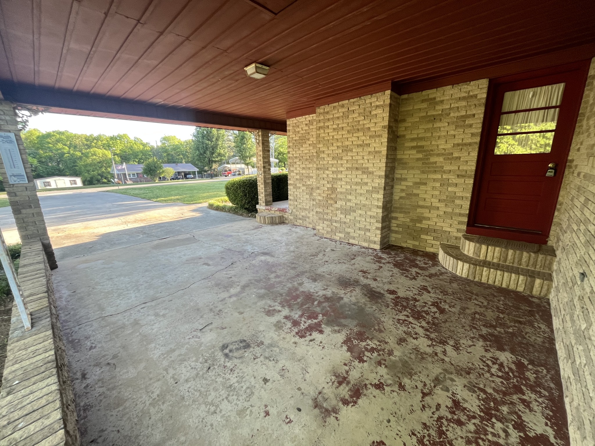 1619 Railroad Bed Road Collinwood, TN 38450 - Photo 52 of 54 a view of a porch with a table and chairs next to a yard