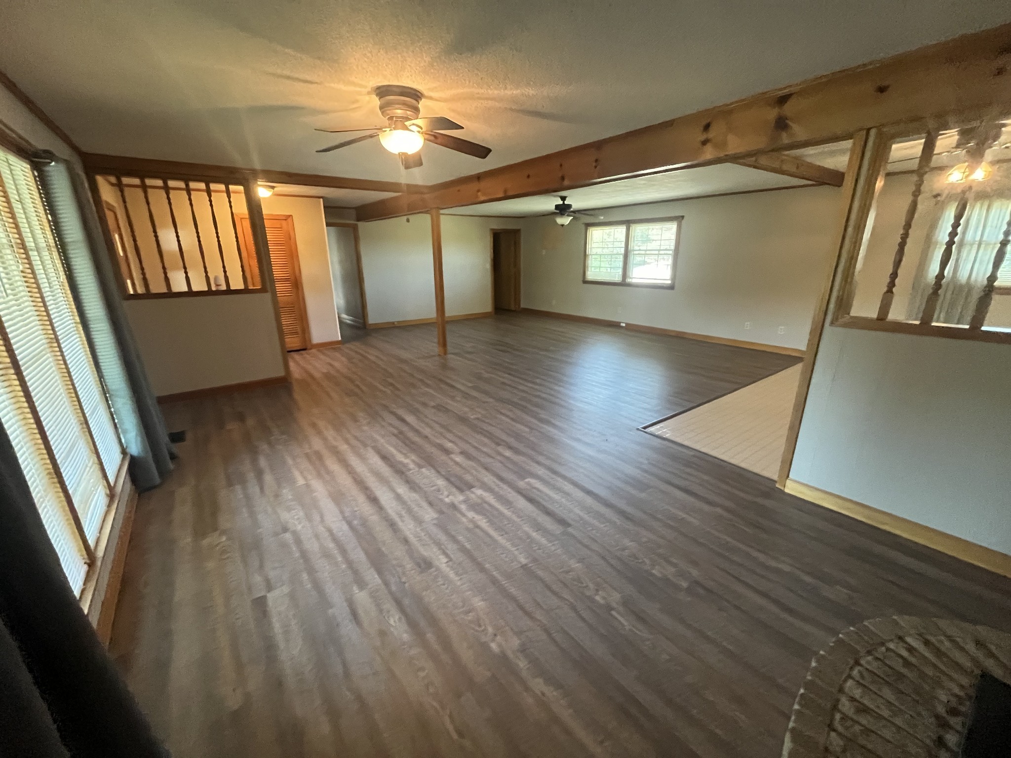 1619 Railroad Bed Road Collinwood, TN 38450 - Photo 9 of 54 wooden floor in an empty room with a window